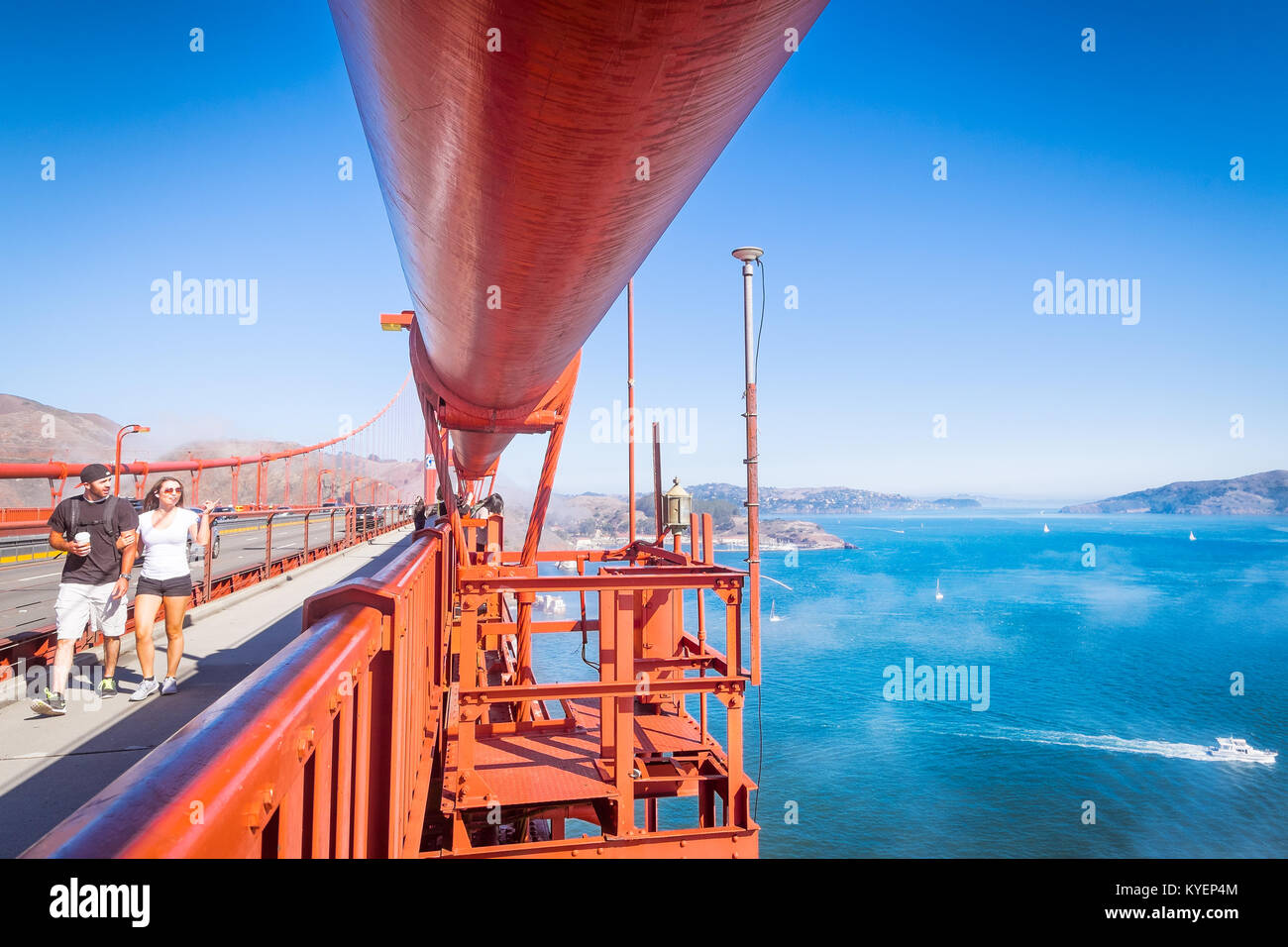 SAN FRANCISCO, CA- Oct. 11, 2015: Golden Gate Bridge on a clear sunny day. Close up view of the massive cable structure that holds up the famous bridg Stock Photo