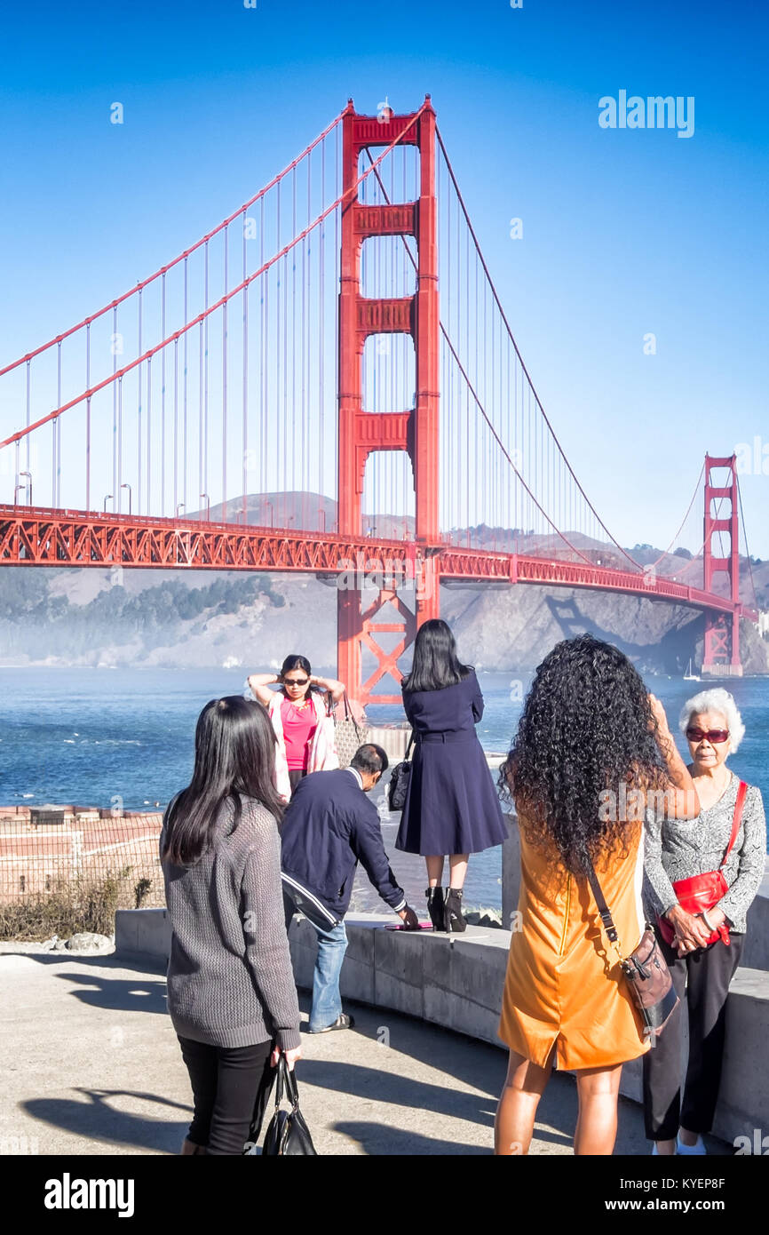 SAN FRANCISCO, CA- Oct. 11, 2015: Golden Gate Bridge is the backdrop for family pictures and selfies from this popular view point. People take turns p Stock Photo