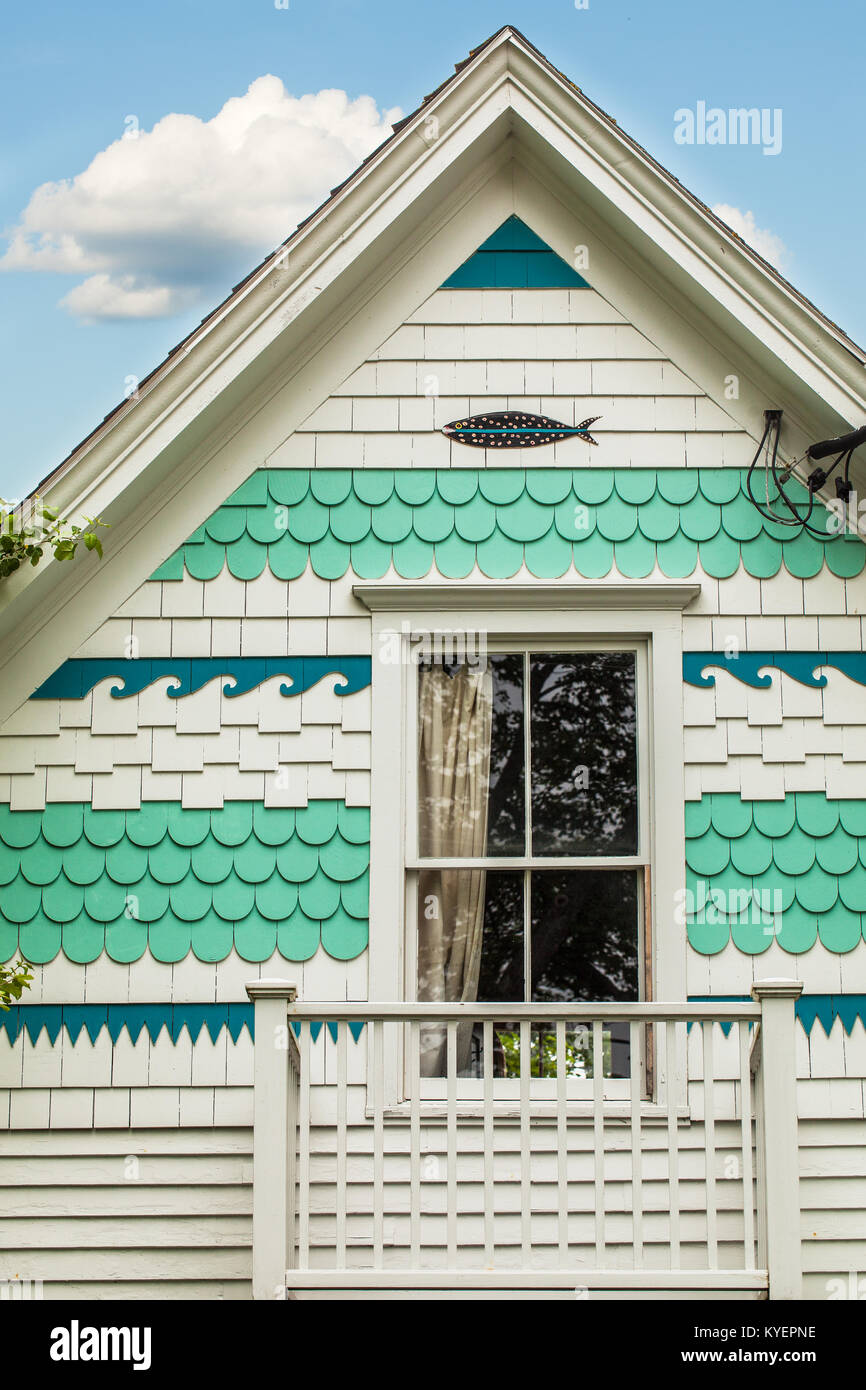 Seaside Cottage Exterior With Painted Shingles In A Nautical
