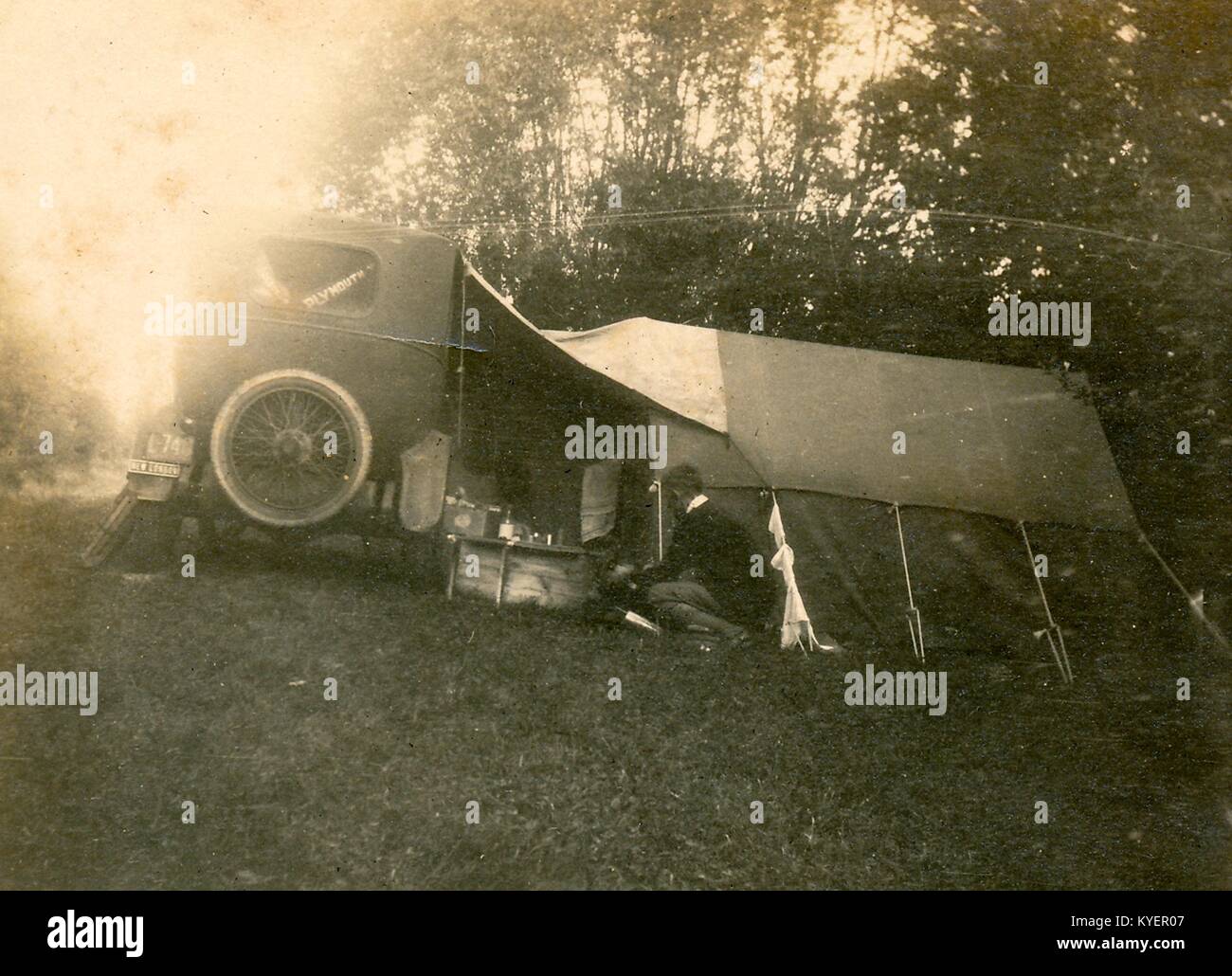 Car camping setup with automobile and tent during a road trip through New England, 1925. () Stock Photo