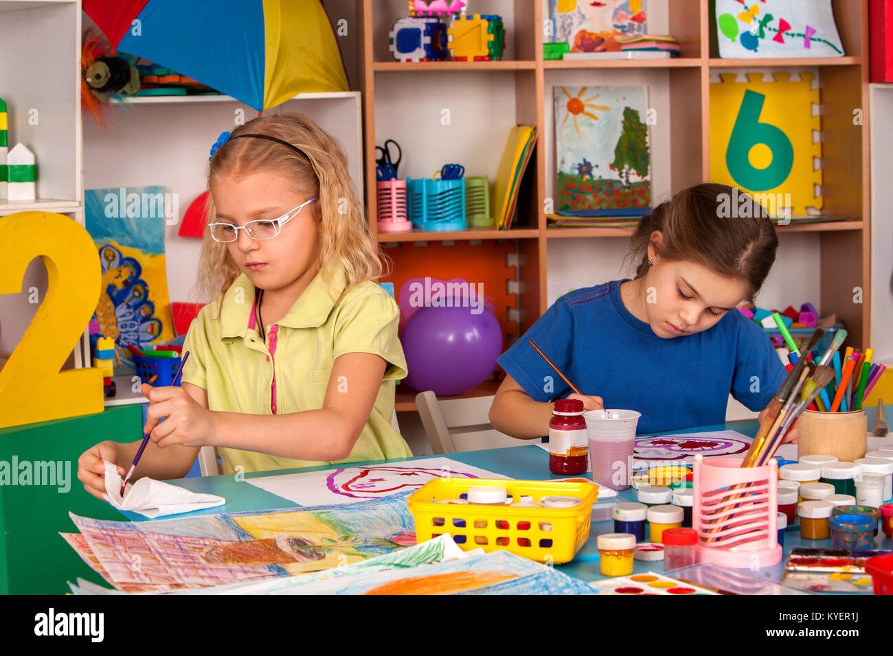 Small students children painting in art school class Stock Photo - Alamy