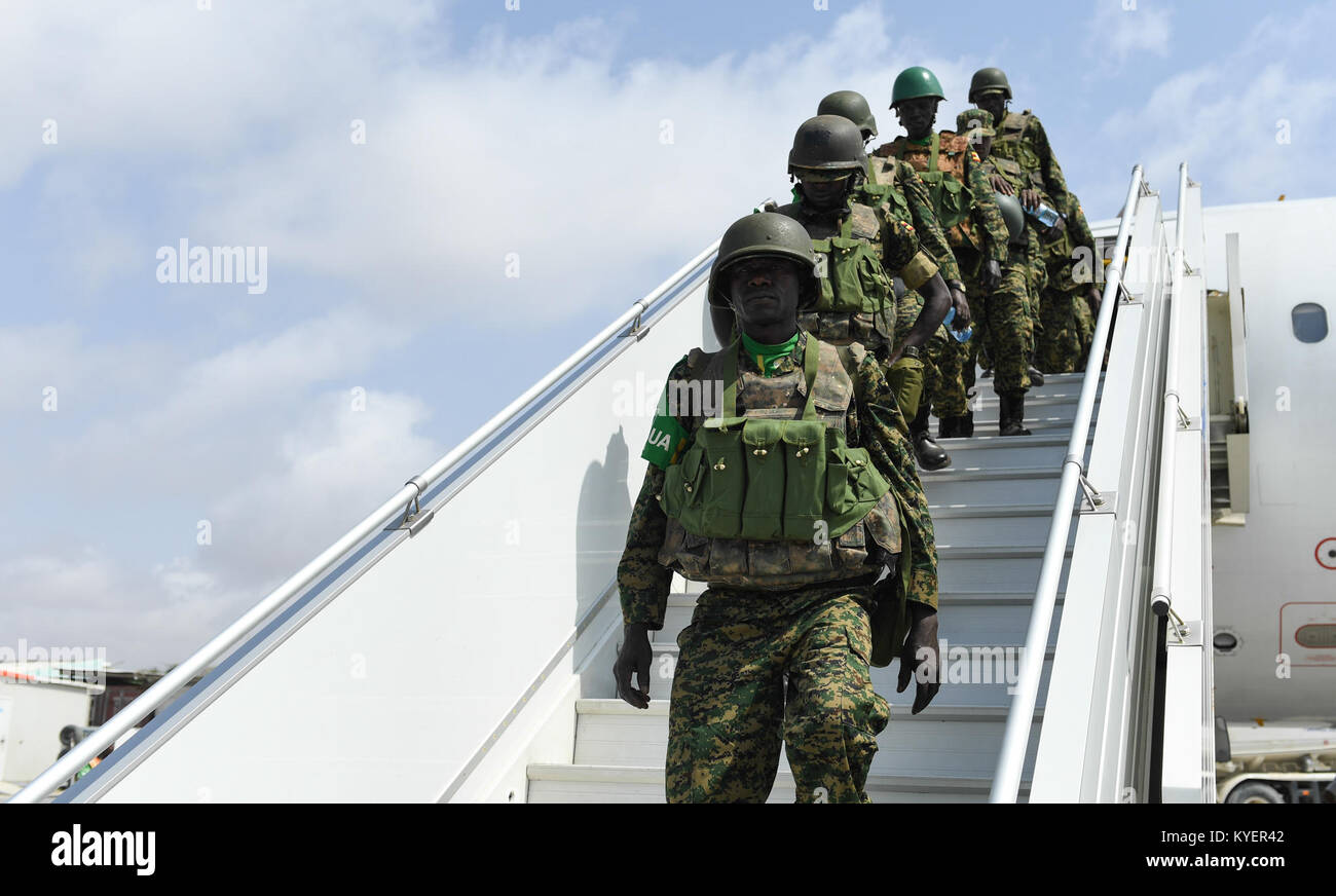 Newly deployed troops who will serve under the African Union Mission in Somalia disembark a plane from Aden Abdulle International Airport in Mogadishu, Somalia, on July 21, 2017. AMISOM Photo Stock Photo