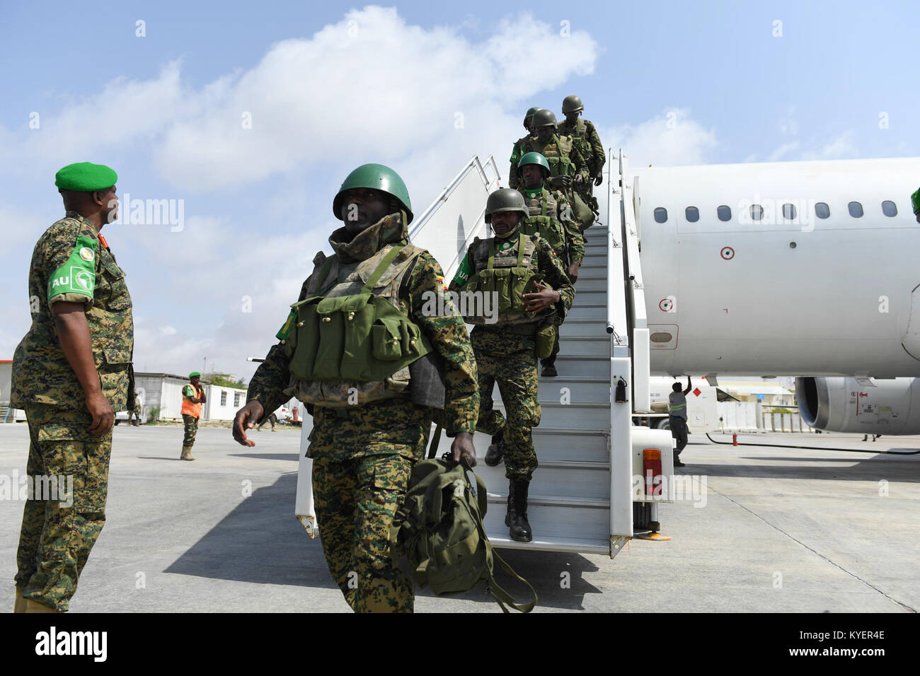 Newly deployed troops who will serve under the African Union Mission in Somalia disembark a plane from Aden Abdulle International Airport in Mogadishu, Somalia, on July 21, 2017. AMISOM Photo Stock Photo