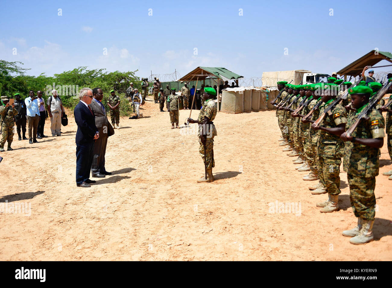 The Special Representative of the Chairperson of the African Union Commission (SRCC) for Somalia, Ambassador Francisco Caetano Madeira and the Special Representative of the UN Secretary-General (SRSG) for Somalia, Michael Keating at a guard parade mounted by soldiers of the Ugandan contingent serving under the African Union Mission in Somalia (AMISOM). The two officials were on a working visit to Barawe, Lower Shabelle region on November 15, 2017. AMISOM Photo / Raymond Baguma Stock Photo