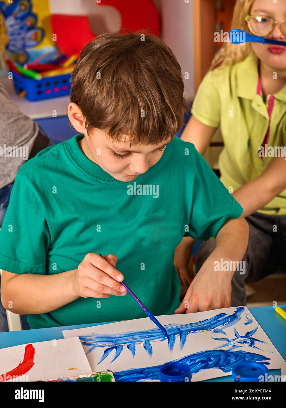 Small students boy painting in art school class Stock Photo - Alamy
