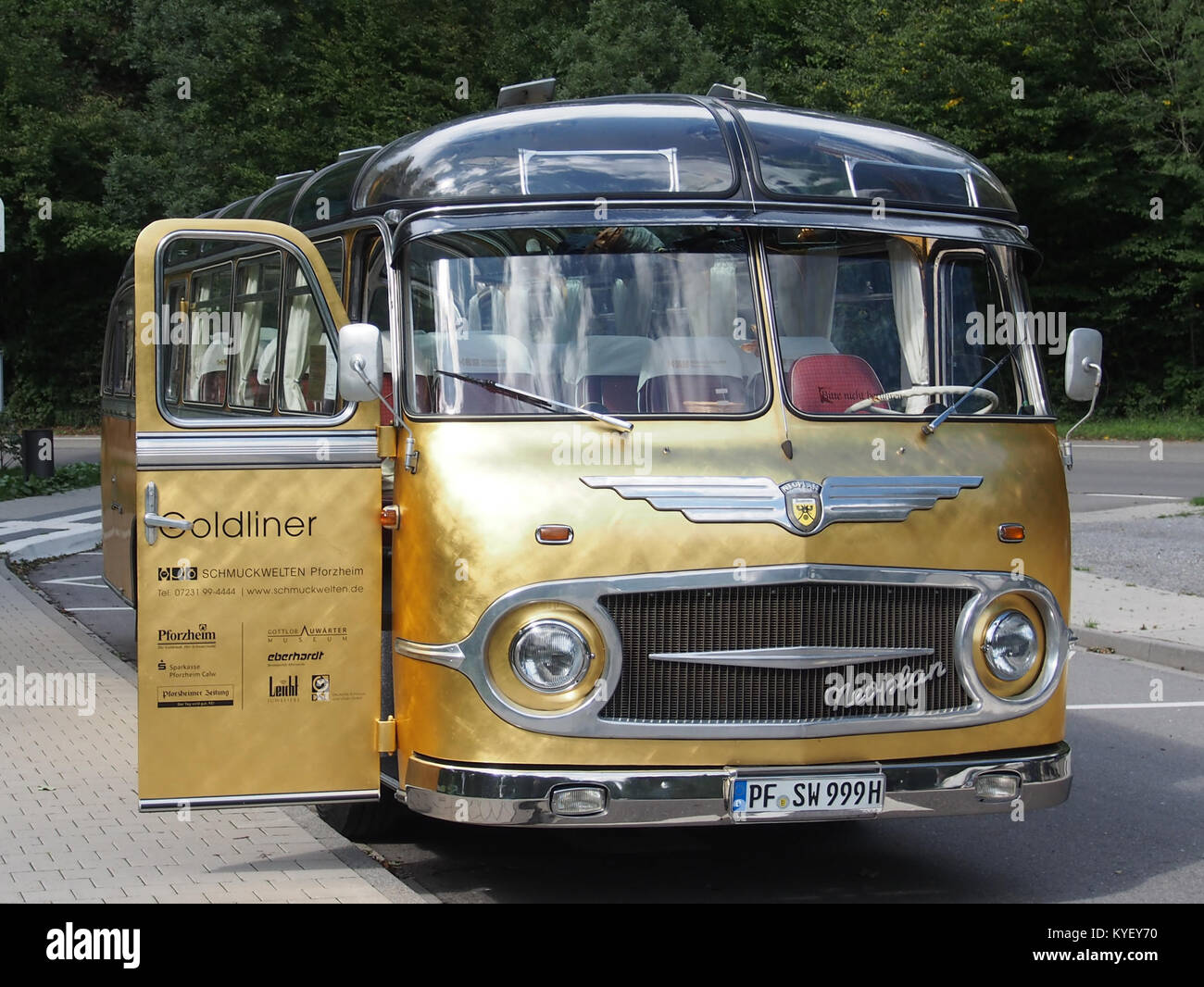 A photograph of a Neoplan bus at Schmuckwelten in Pforzheim, Germany, showcasing the modern design and architecture of the vehicle in a museum or exhibition context. Stock Photo