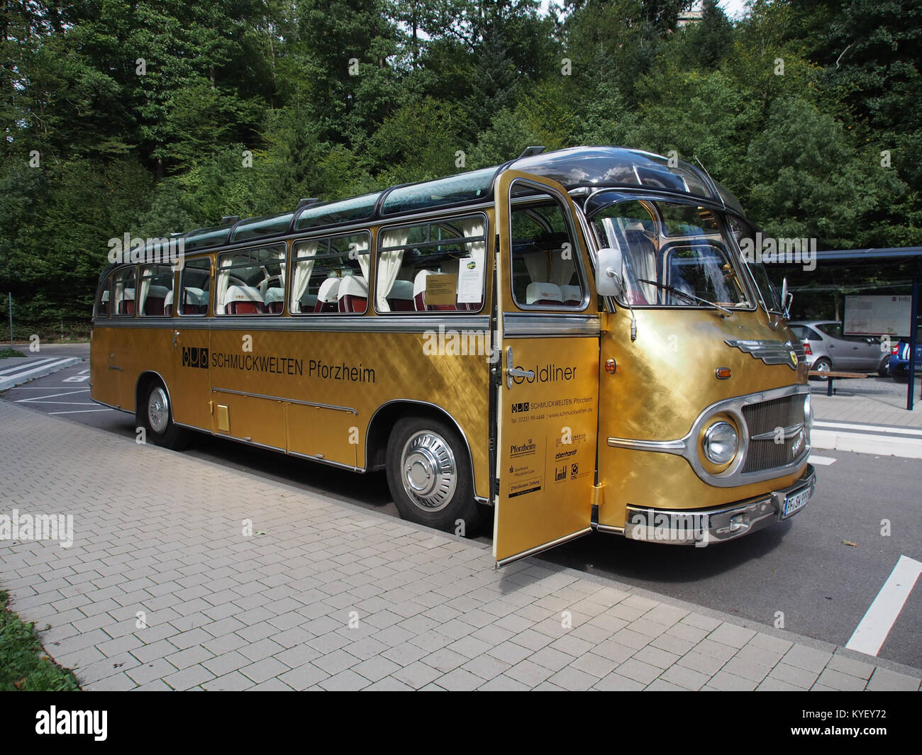 A photograph of a Neoplan Schmuckwelten, a luxury vehicle, at an exhibition or event in Pforzheim, Germany, showcasing its high-end design and craftsmanship. Stock Photo