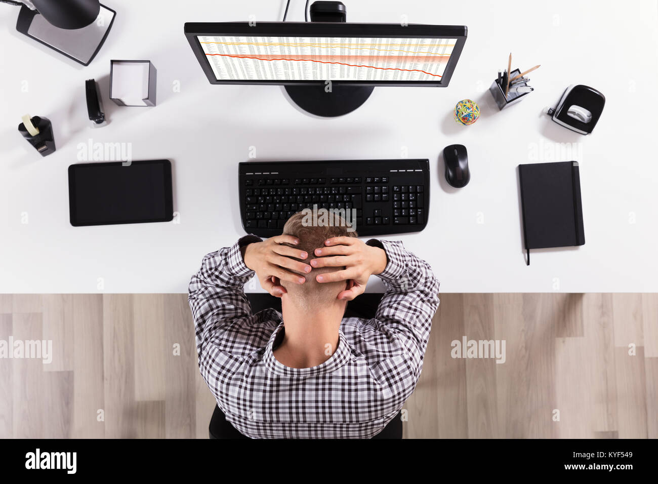 Elevated View Of A Frustrated Business Man In Front Of Computer At ...
