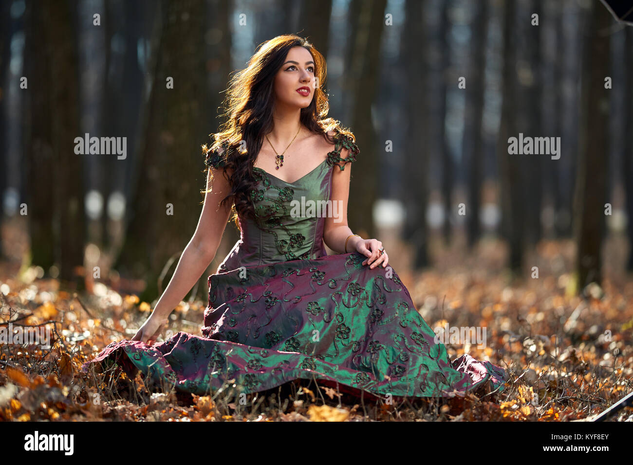 Full length portrait of a beautiful woman in green dress outdoor Stock ...