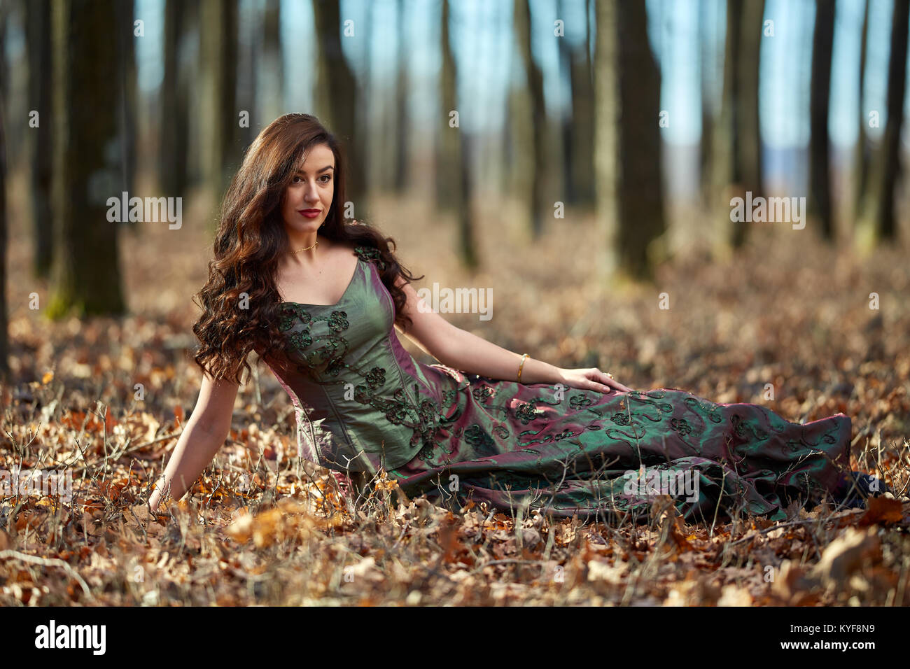 Full length portrait of a beautiful woman in green dress outdoor Stock ...