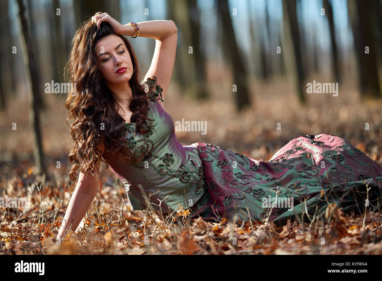 Full length portrait of a beautiful woman in green dress outdoor Stock ...