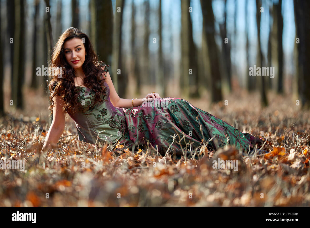 Full length portrait of a beautiful woman in green dress outdoor Stock ...