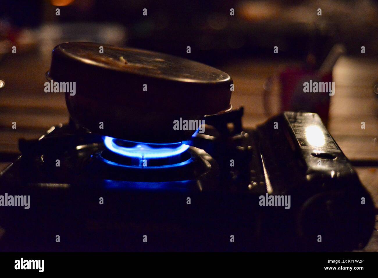 A portable gas stove burning blue at platypus bushcamp, Finch Hatton
