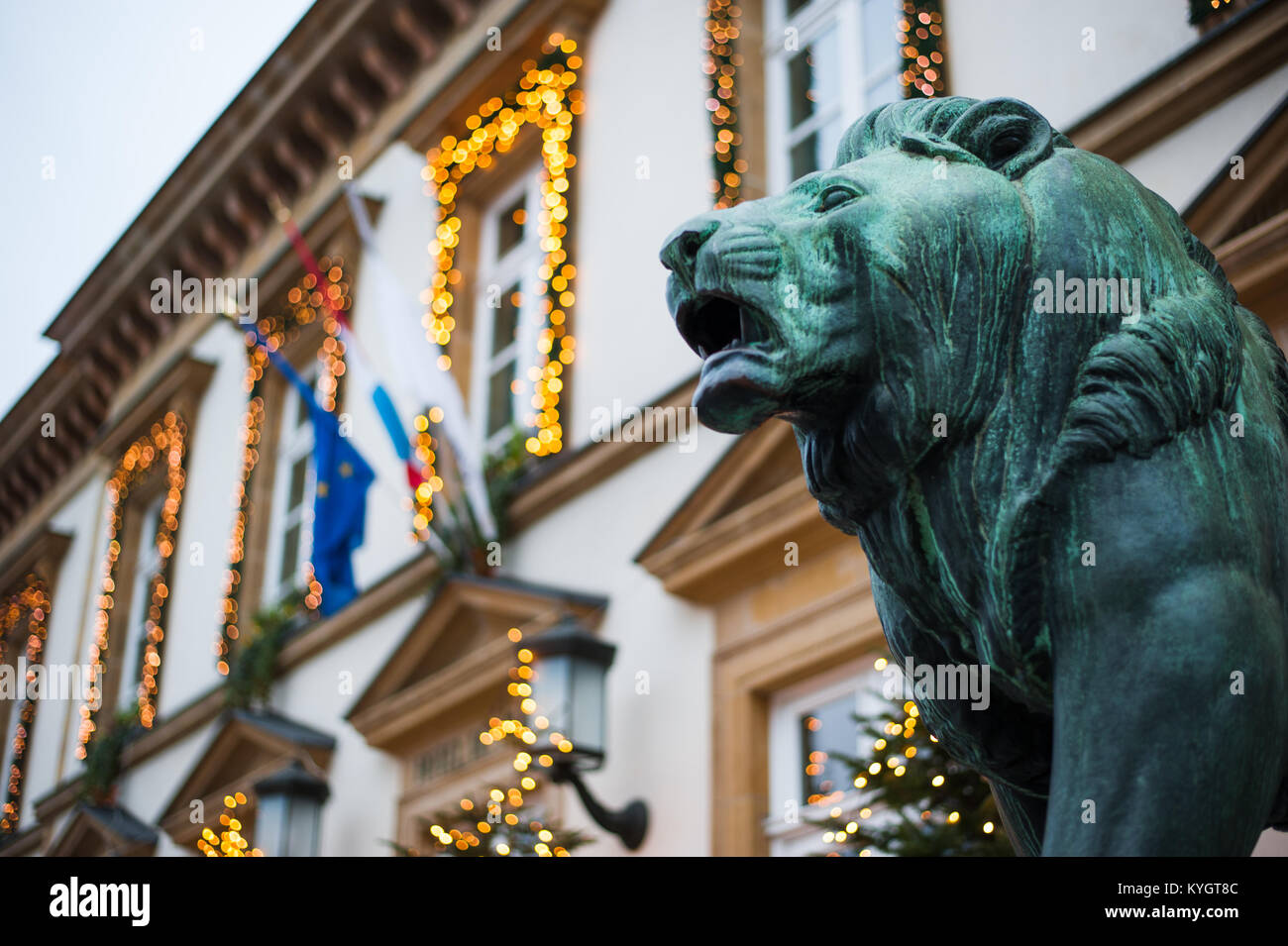 Bronze lion sculpture in front of the Hotel de Ville at night, Luxembourg City Stock Photo