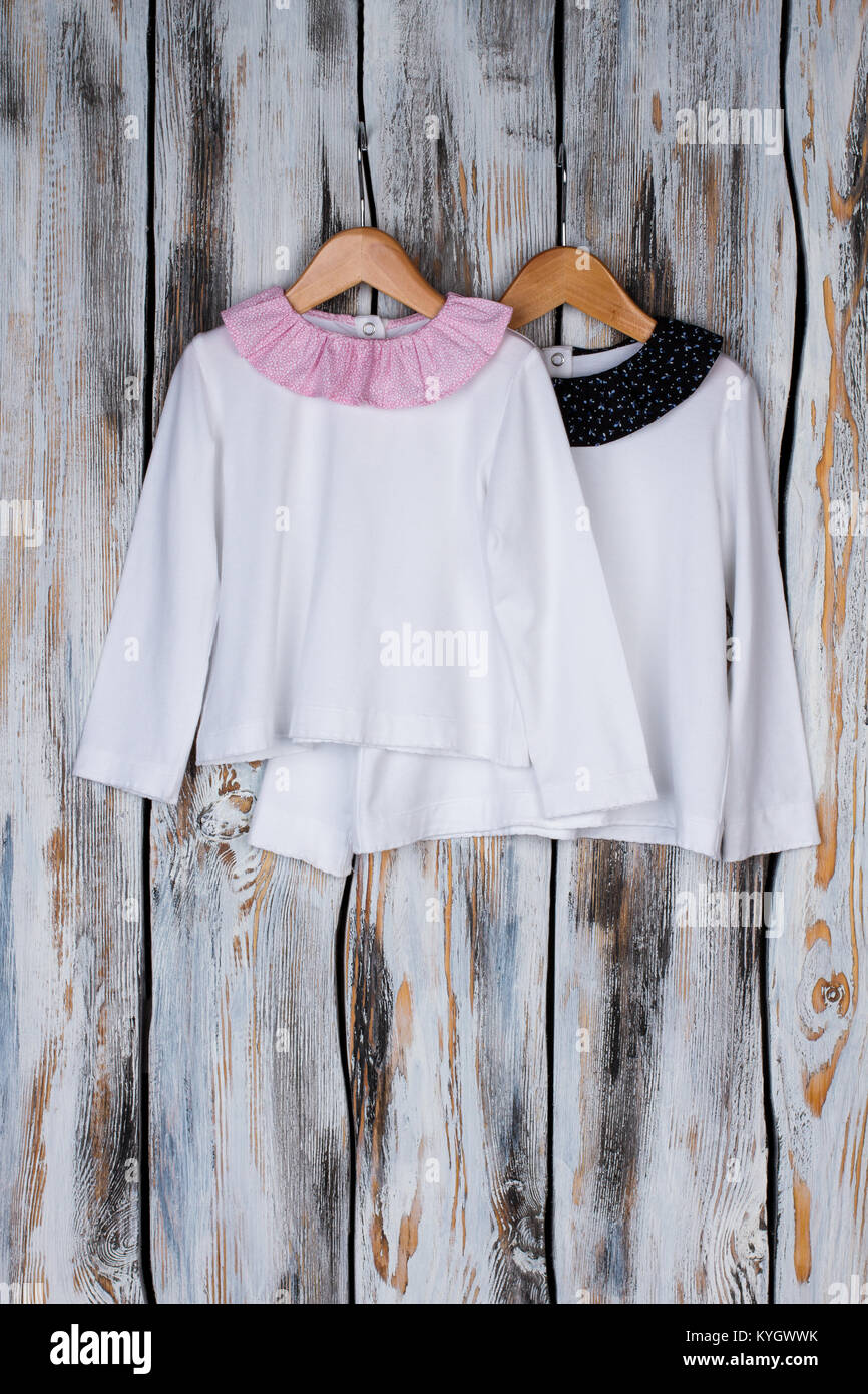 Girls nightwear on wooden hangers Stock Photo