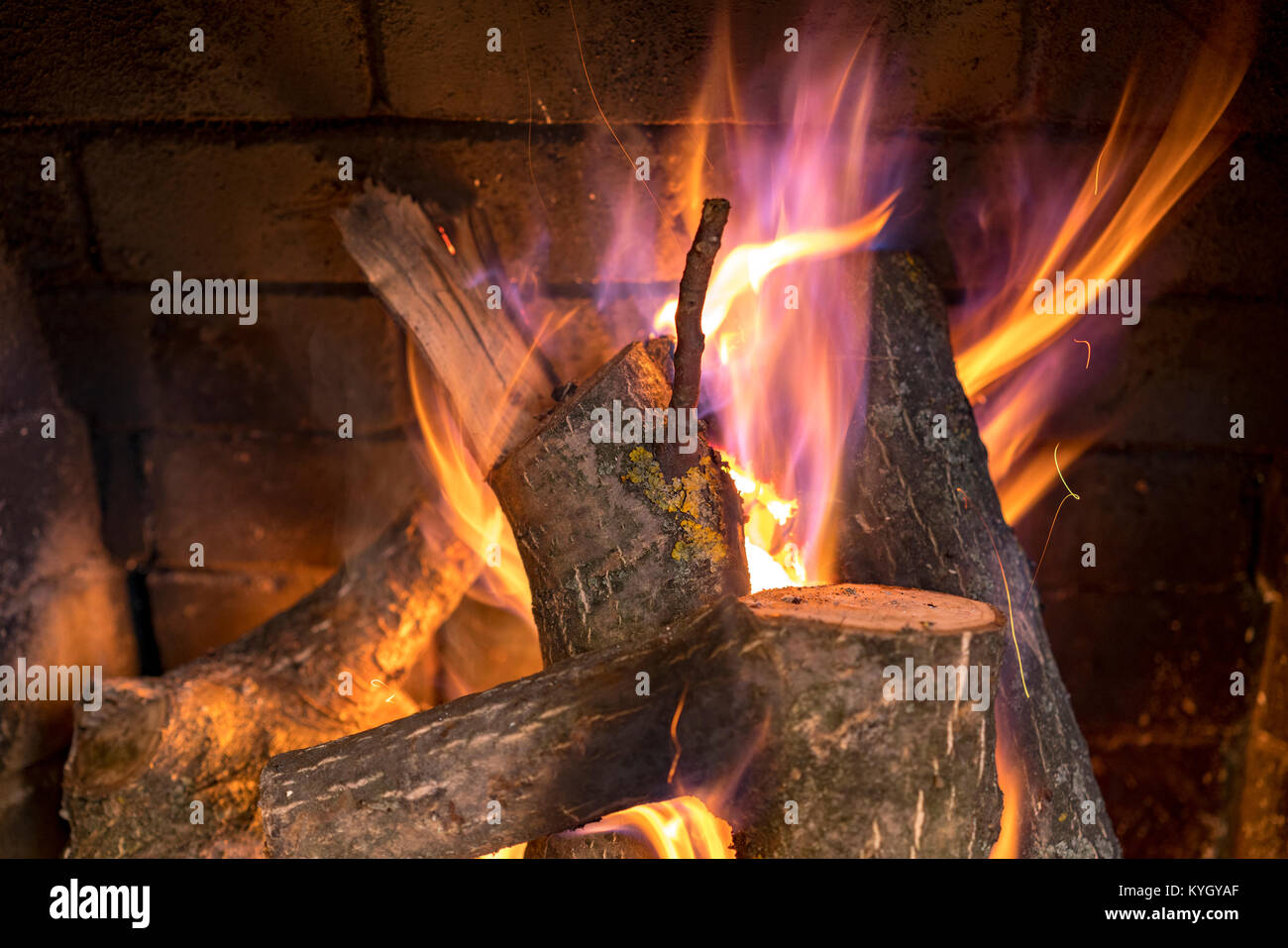 Burning logs in a fireplace Stock Photo Alamy