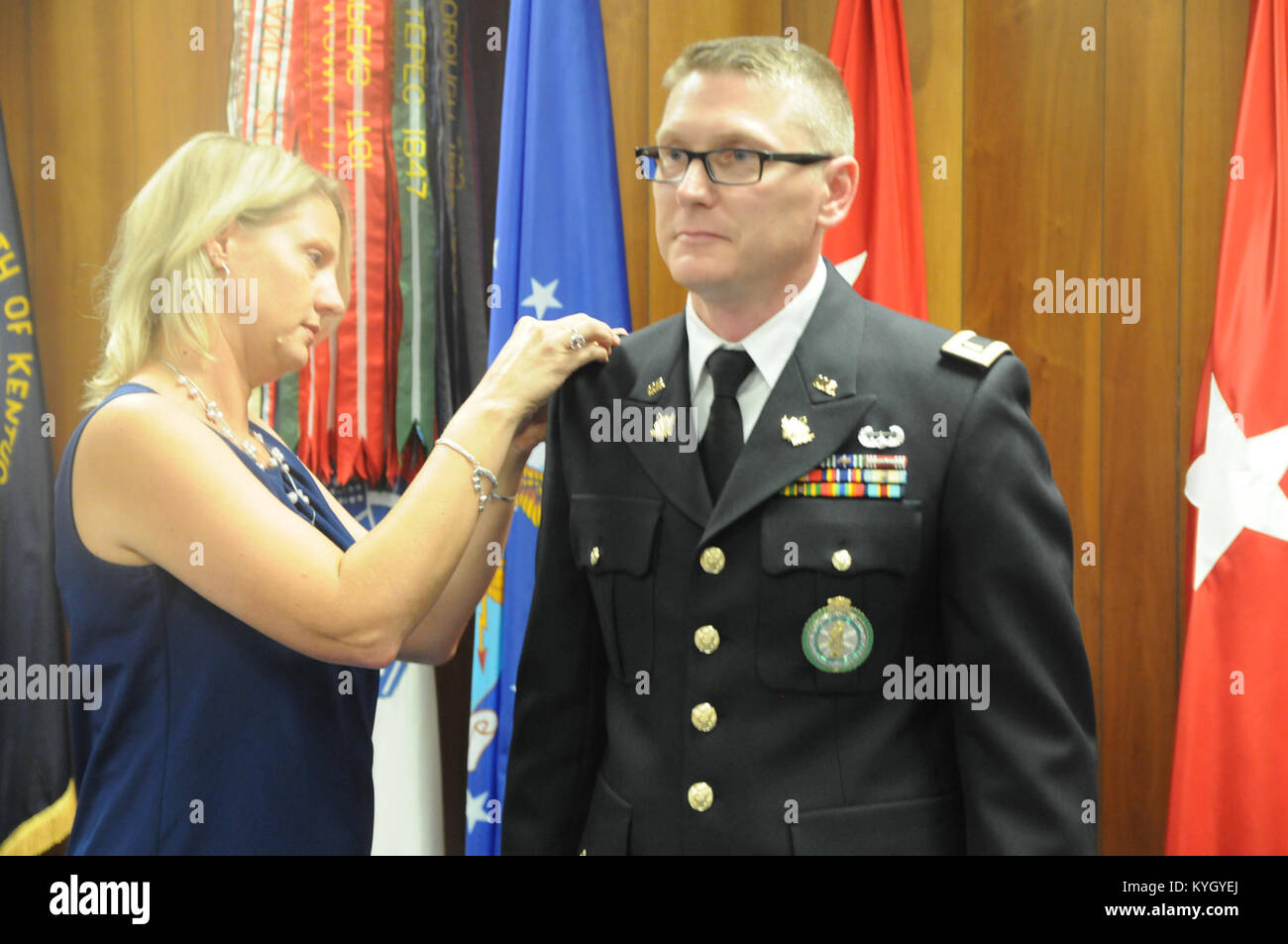 Chaplain Candidate 2nd Lt. Adams' wife pins him at the Chaplain