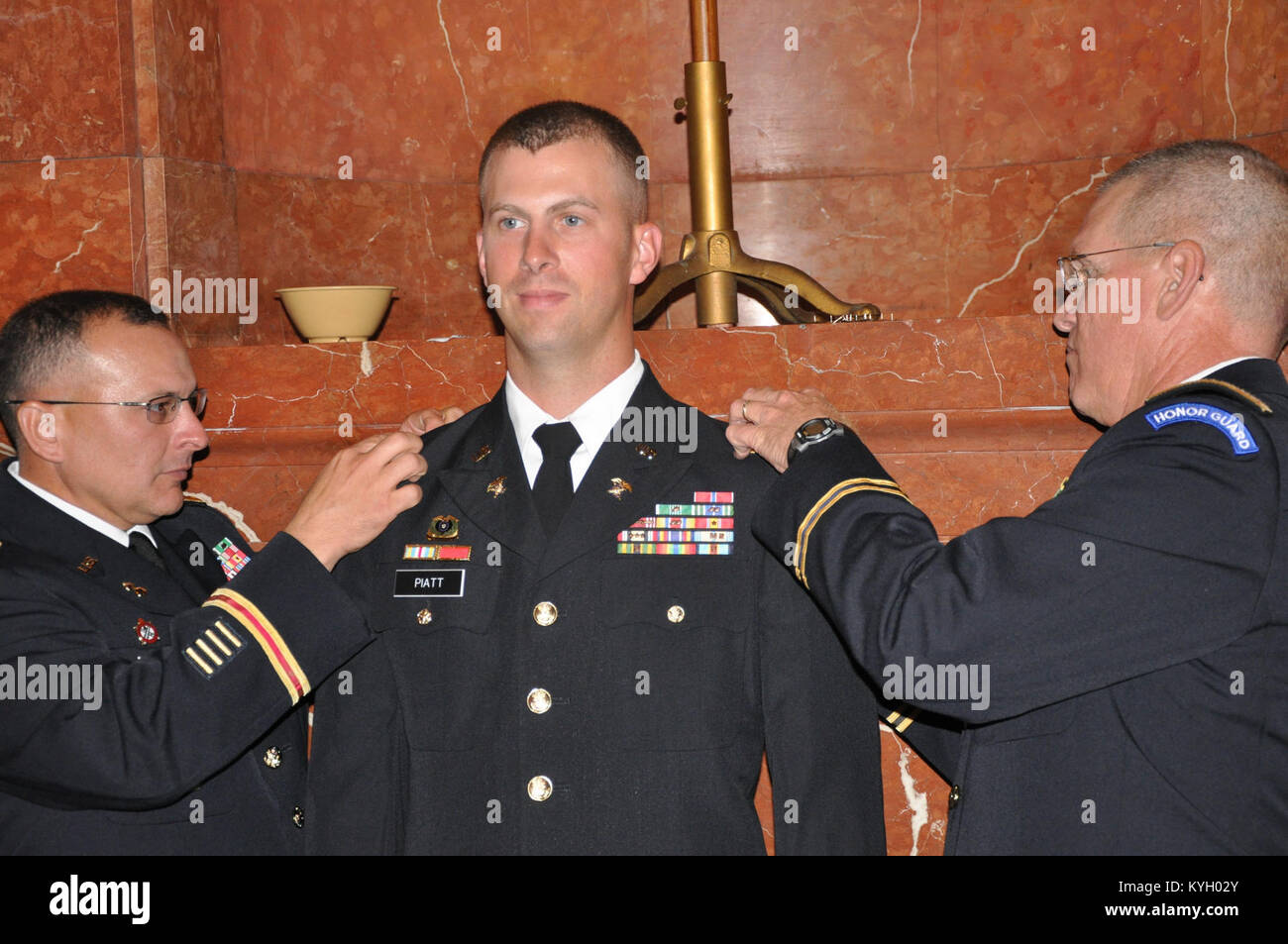 Kentucky Guardsman Brian Piatt stands at attention while being pinned ...