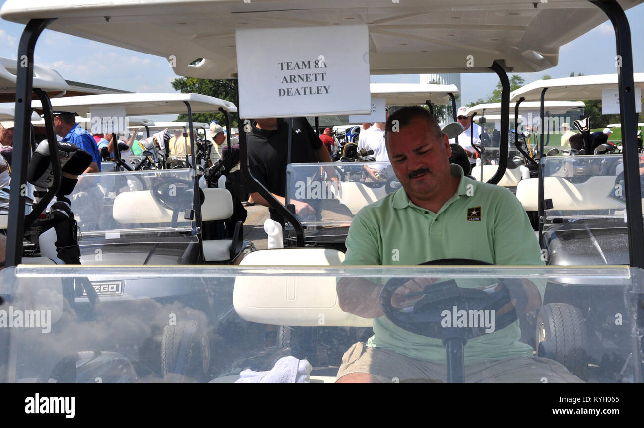Kentucky Guardsman Chief Warrant Officer Larry hops in his golf