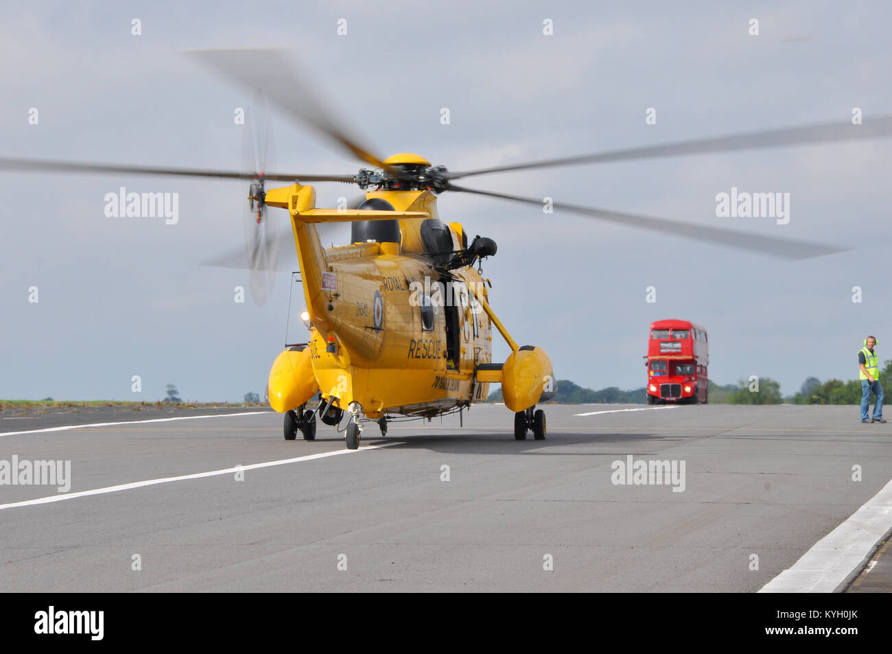 raf-westland-sea-king-helicopter-heading-towards-a-red-london-bus-on-a