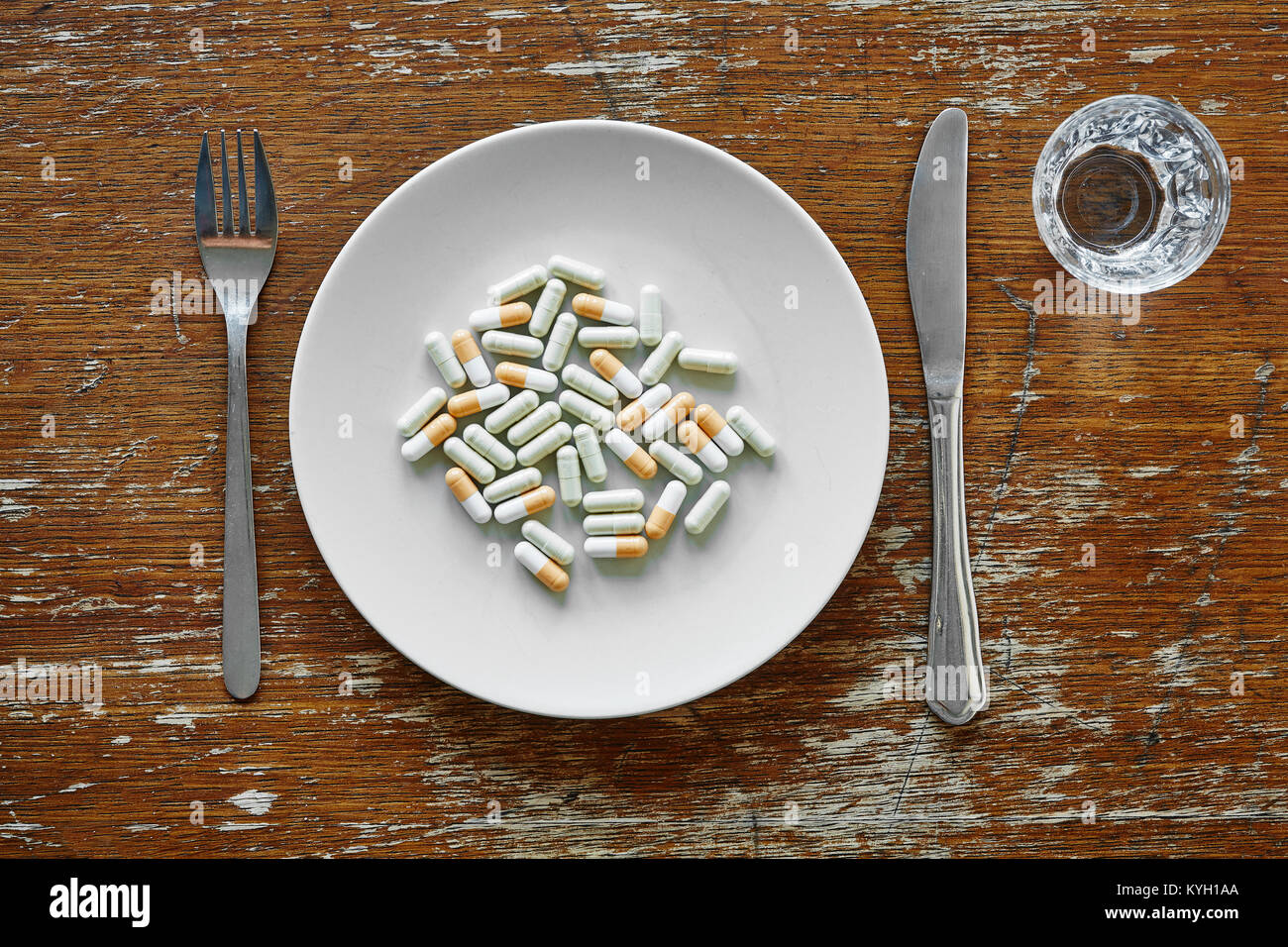 white plate filled with variety of pills Stock Photo