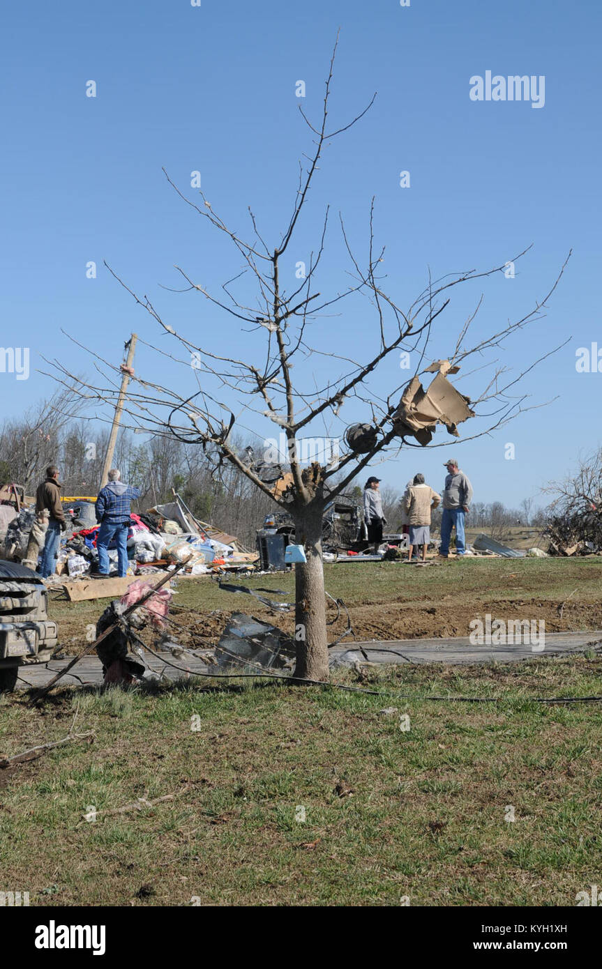 Residents of East Bernstadt, Ky. clean up debris left by the storm that swept across the state of Kentucky Mar. 3. (Photo by Spc. Brandy Mort, 133rd Mobile Public Affairs Detachment, Kentucky National Guard) Stock Photo