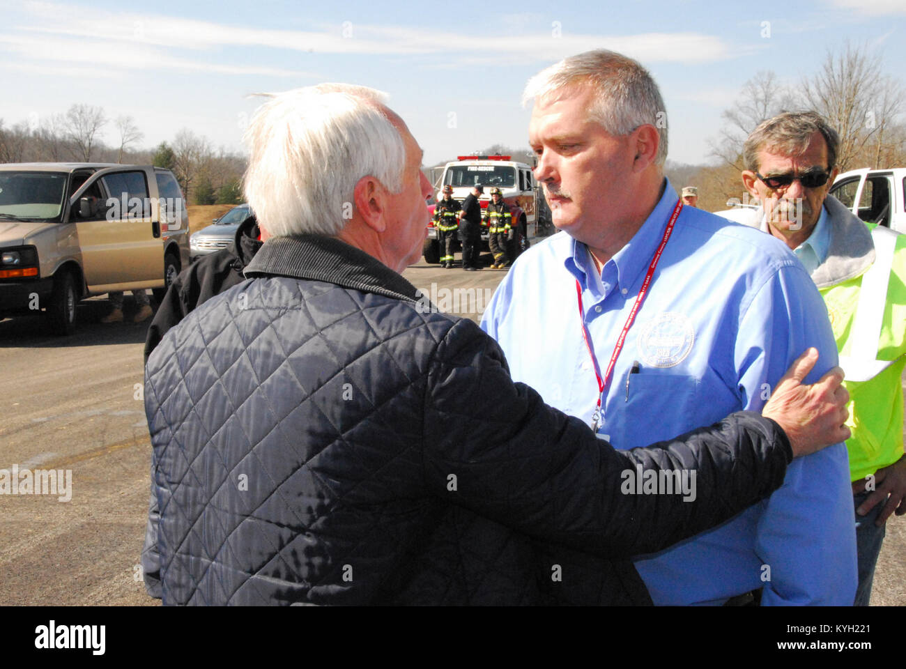 Gov. Steve Beshear comforts Tim Conley, County Judge of West Liberty in