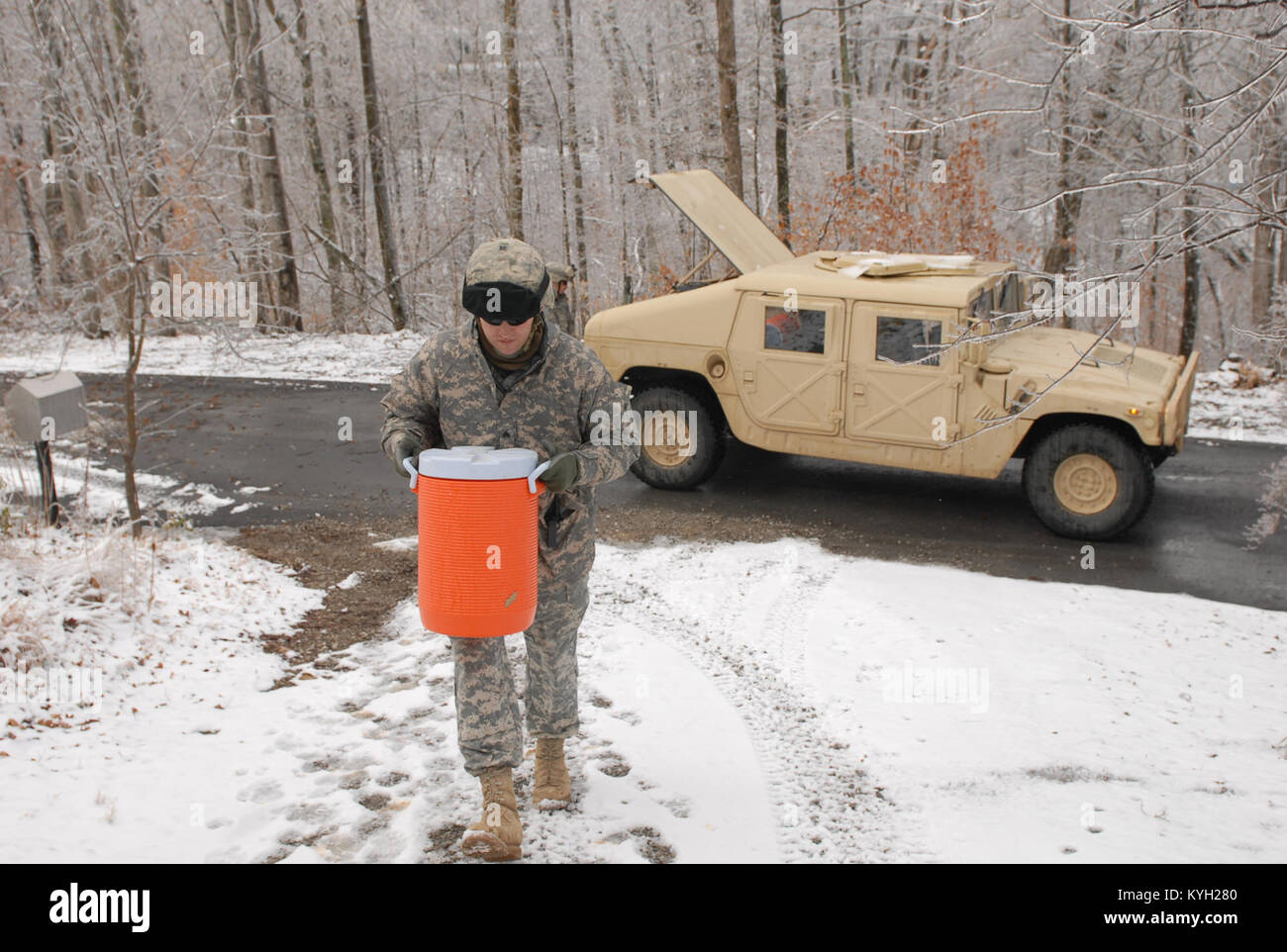 Army Sgt. Joshua White, 206th Engineer Battalion, delivers water to