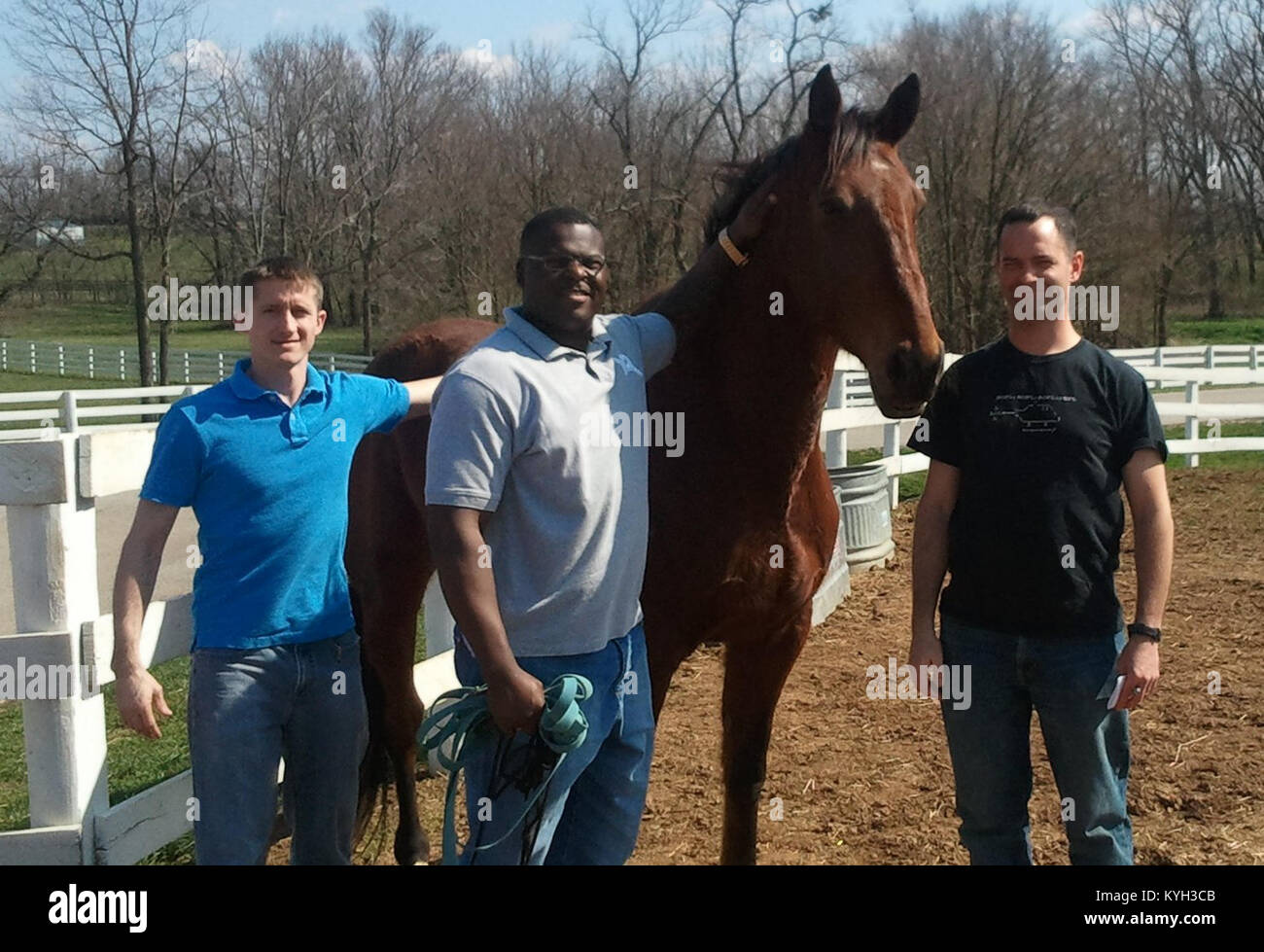 Sgt. Cody Stagner, Sgt. 1st. Class Craig Quisenberry and 1st Lt. Stephen Lawson with their new friend Nathan. Nathan is part of the Horses for Heroes program, which is run by Central Kentucky Riders for Hope. The program helped Kentucky National Guard Soldiers as they explored ways of building resilience in the wake of wartime deployments. (Photo by 1st Lt. Rob Cooley, Kentucky National Guard Resilience Program) Stock Photo