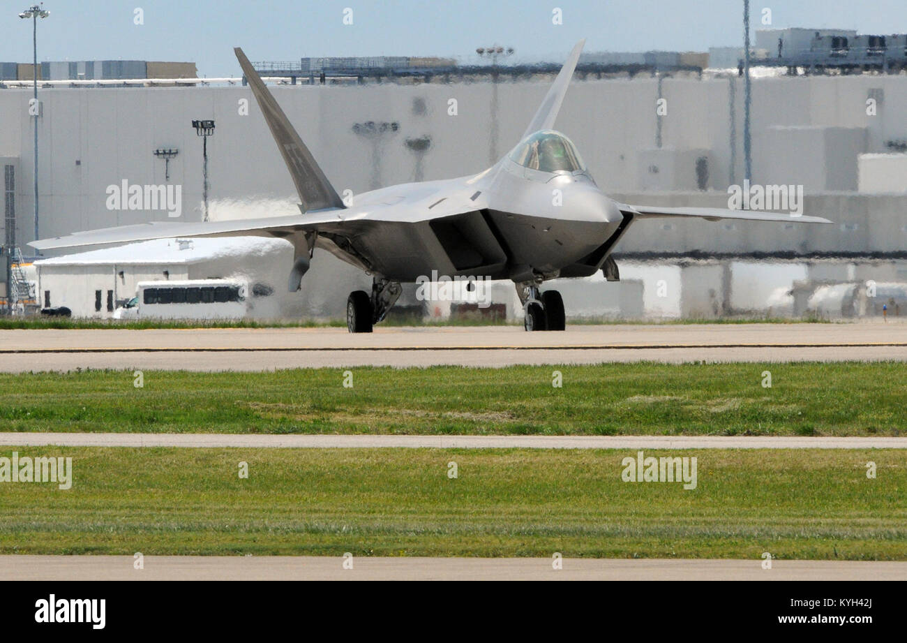 An F-22 Raptor fighter plane lands at the Kentucky Air National Guard Base in Louisville, Ky. after performing several practice maneuvers April 20, 2012.  The Raptor is the Air Force's premiere fighter plane with several top secret functional and design features.  (Photo by: Spc. David Bolton, Public Affairs Specialist, 133rd Mobile Public Affairs Detachment, Kentucky Army National Guard). Stock Photo