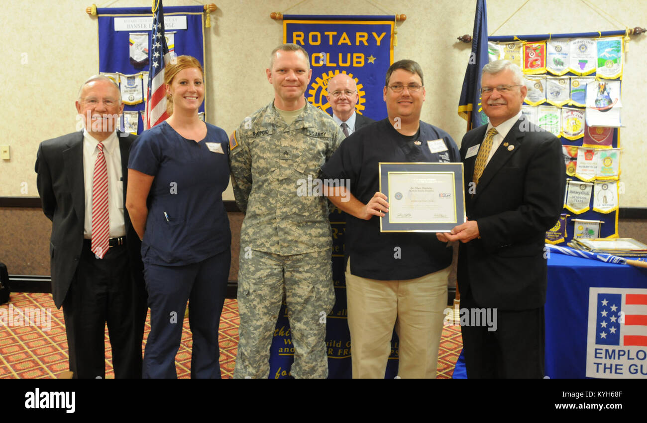 Dr. Marc Marlette is presented the Patriotic Employer Award by retired