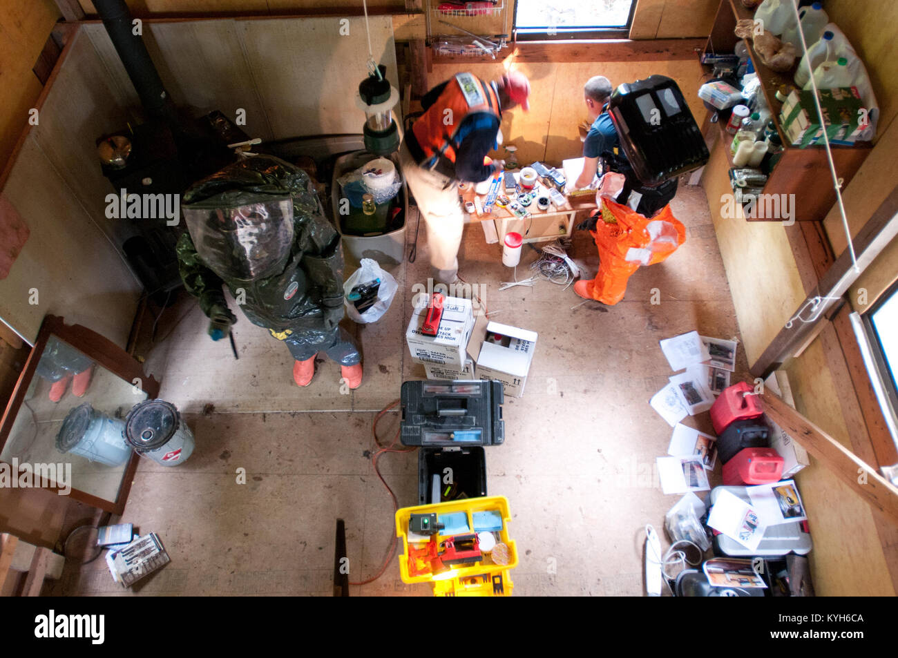 Members of the 41st Civil Support Team survey a cabin where suspected ...