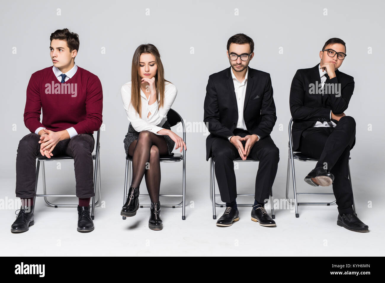 Four people wait for job interview sitting on chair isolated on white ...