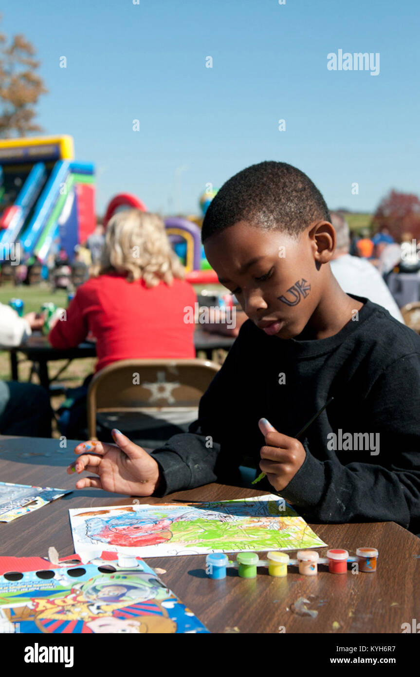 Adarius Hite, son of Kentucky Air National Guard member 2nd Lt. Angela Hite, paints pictures during family day at the 123rd Airlift Wing in Louisville, Ky., Oct. 21, 2012.  (Kentucky Air National Guard photo by Senior Airman Vicky Spesard) Stock Photo