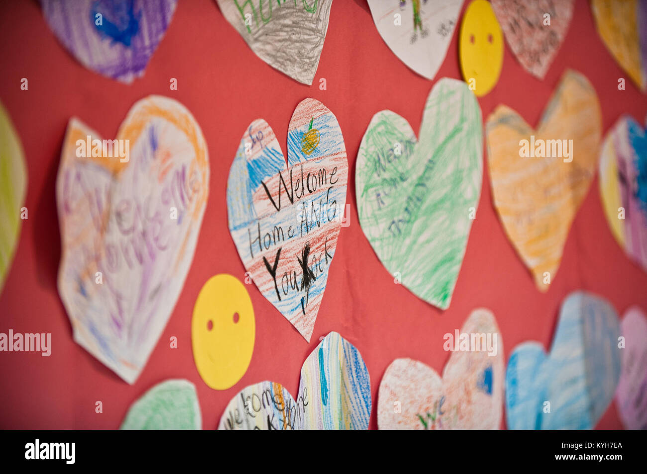 Colorful hearts, made by children at Crums Lane Elementary School in Louisville, Ky., provide a cheerful welcome for 58 Airmen from the 123rd Airlift Wing who returned to Louisville Nov. 10, 2012, after a four-month deployment to the Persian Gulf. The Airmen, all members of the Kentucky Air National Guard, flew daily airlift missions in support of U.S. military operations across the U.S. Central Command Area of Responsibility, which includes Iraq, Afghanistan and Northern Africa. (U.S. Air Force photo by Maj. Dale Greer) Stock Photo