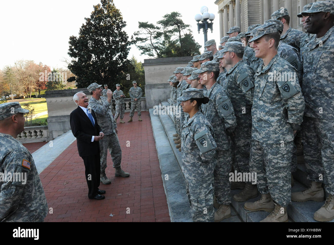 Kentucky Governor, Steve Beshear and the Adjutant General, Maj. Gen. Edward W. Tonini, laugh with new Kentucky Guard recruits on the steps of the State Capitol in Frankfort, Ky., Nov. 20, 2012. (Kentucky National Guard photo by Sgt. Scott Raymond) Stock Photo