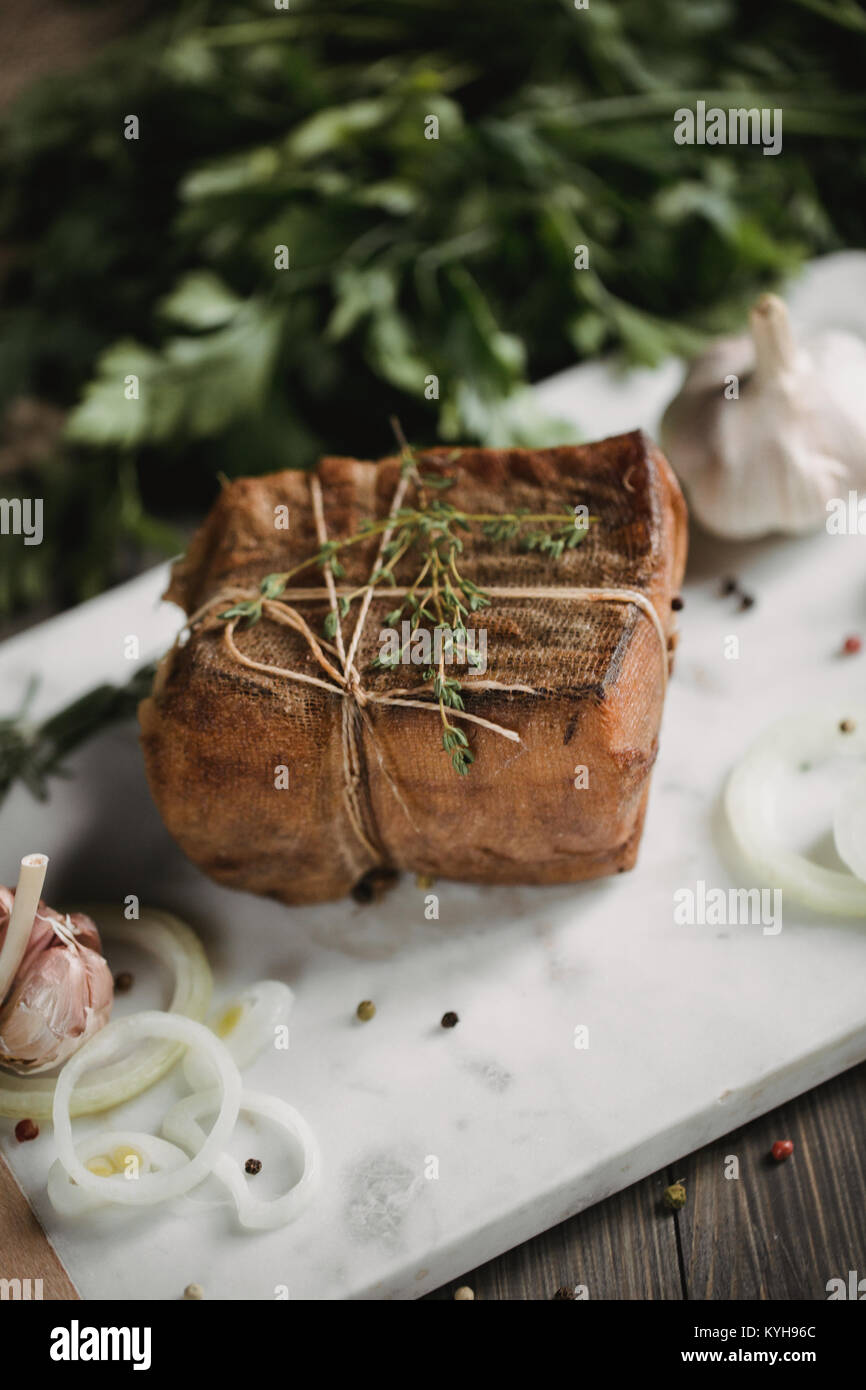 Chunk of salted smoked lard in gauze with a rope.Traditional Russian