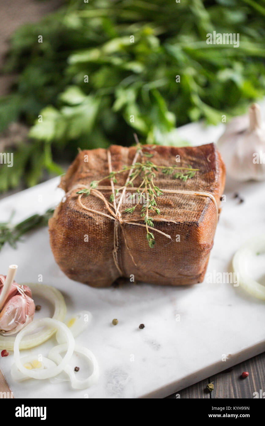 Chunk of salted smoked lard in gauze with a rope.Traditional Russian