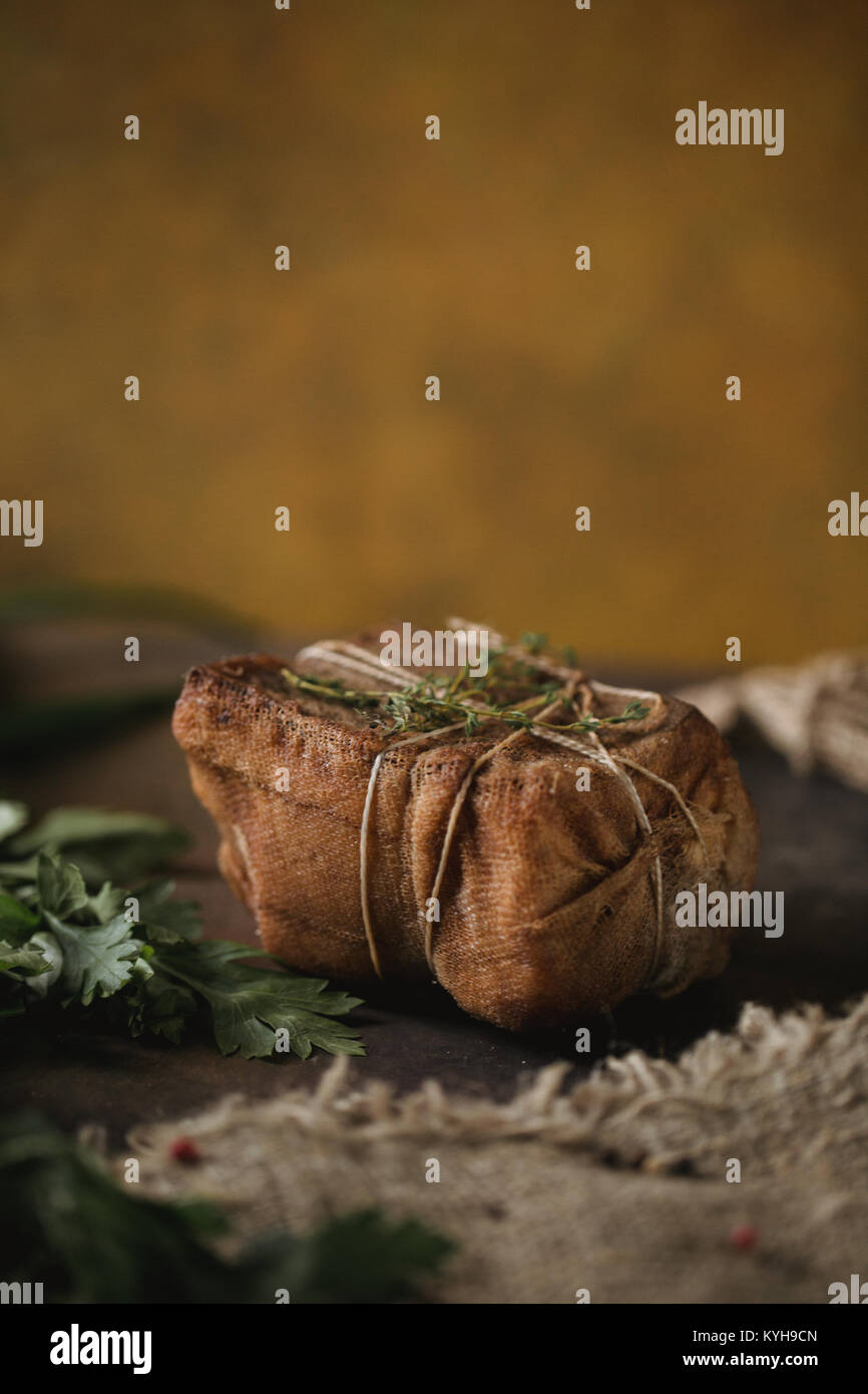 Chunk of salted smoked lard in gauze with a rope.Traditional Russian