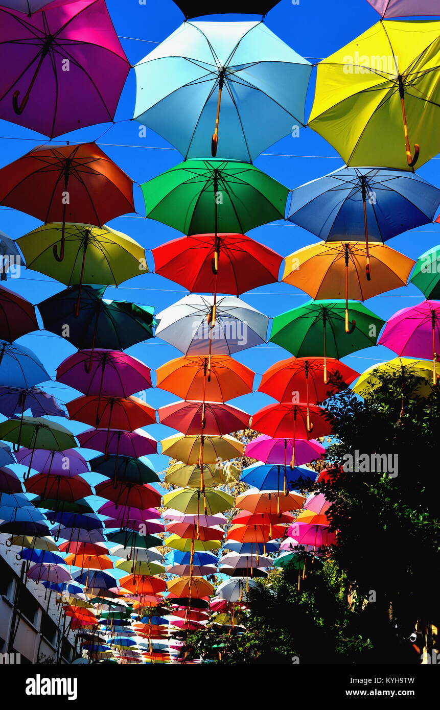 Colorful umbrellas background. Colorful umbrellas in the sky. Street decoration. Stock Photo