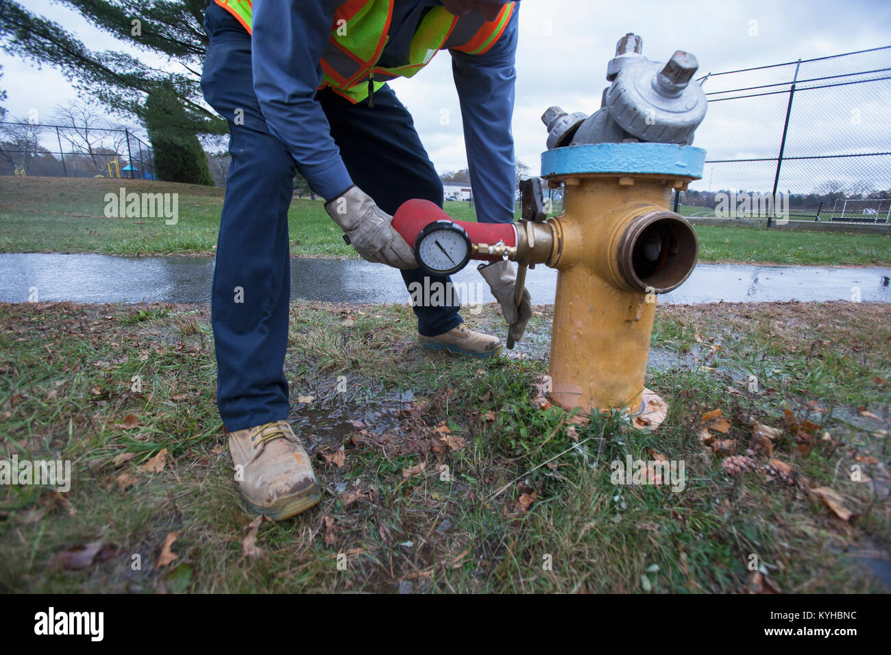 Water department technician removing flushing adapter Stock Photo