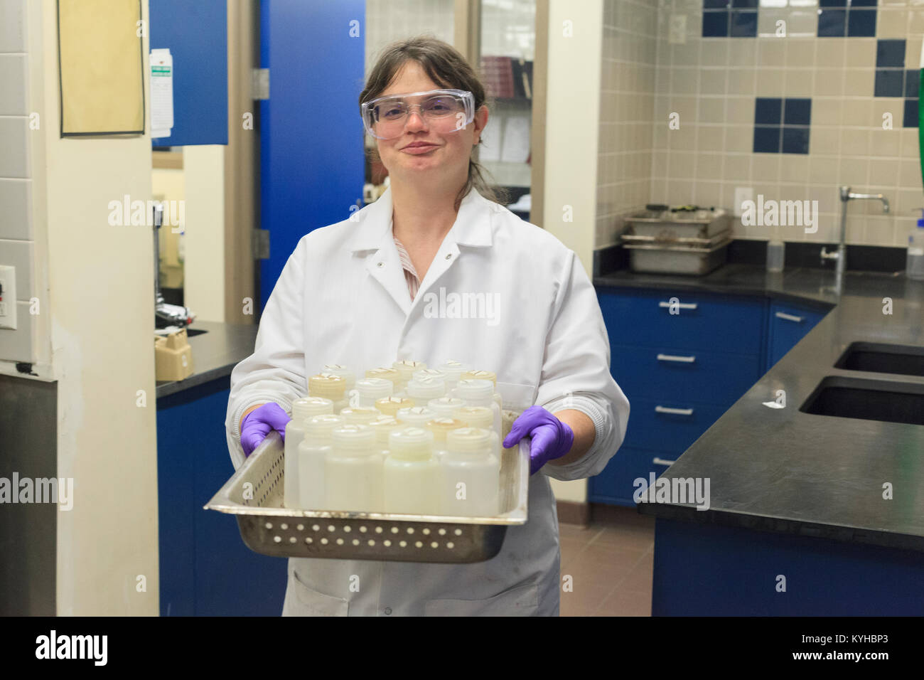 Lab technician preparing sample bottles Stock Photo