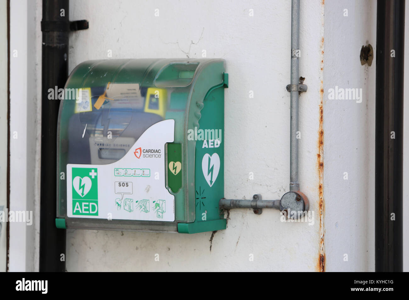 An AED Machine pictured on a wall in a high street in East Wittering, West Sussex, UK. Stock Photo