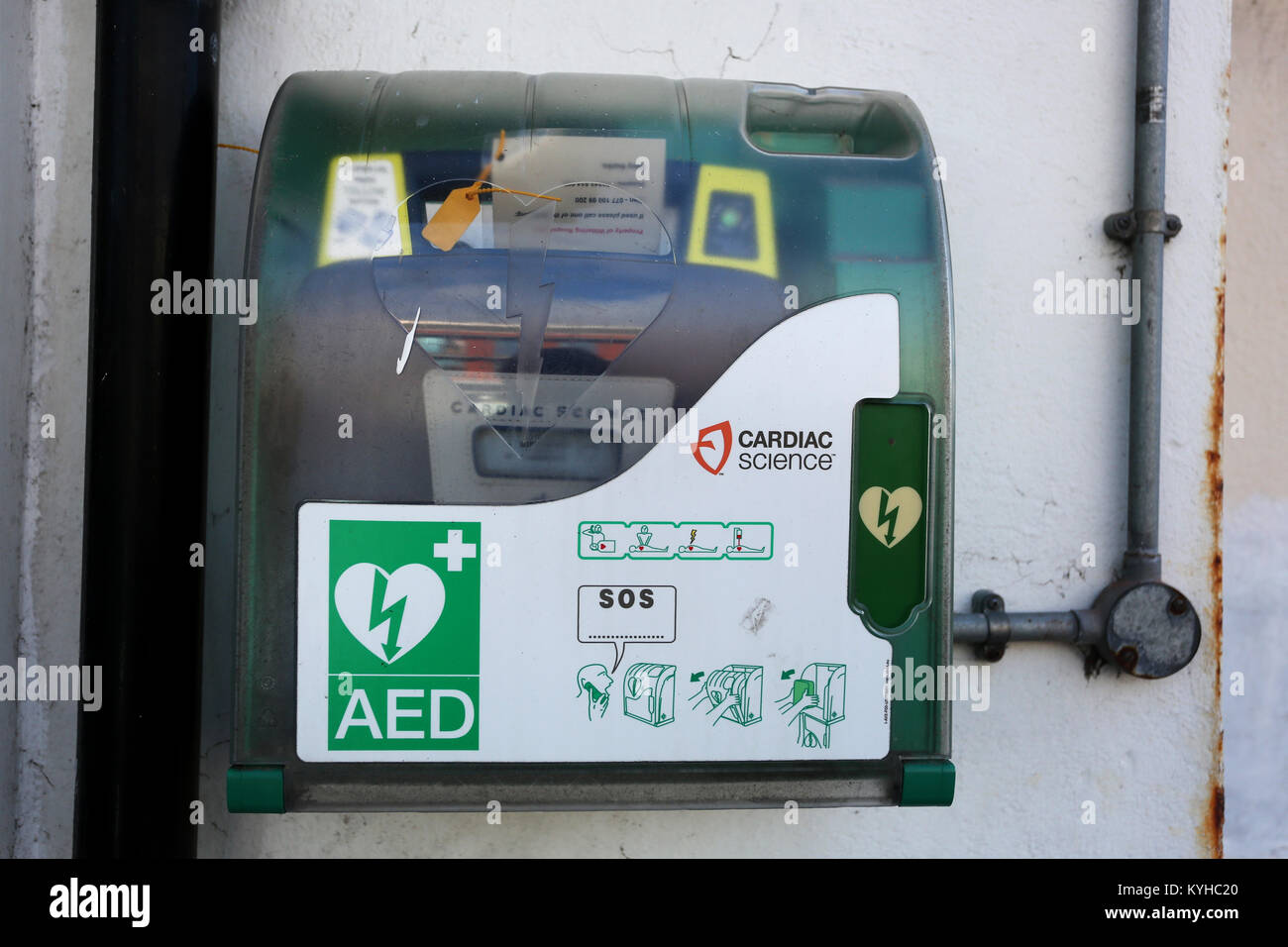 An AED Machine pictured on a wall in a high street in East Wittering, West Sussex, UK. Stock Photo