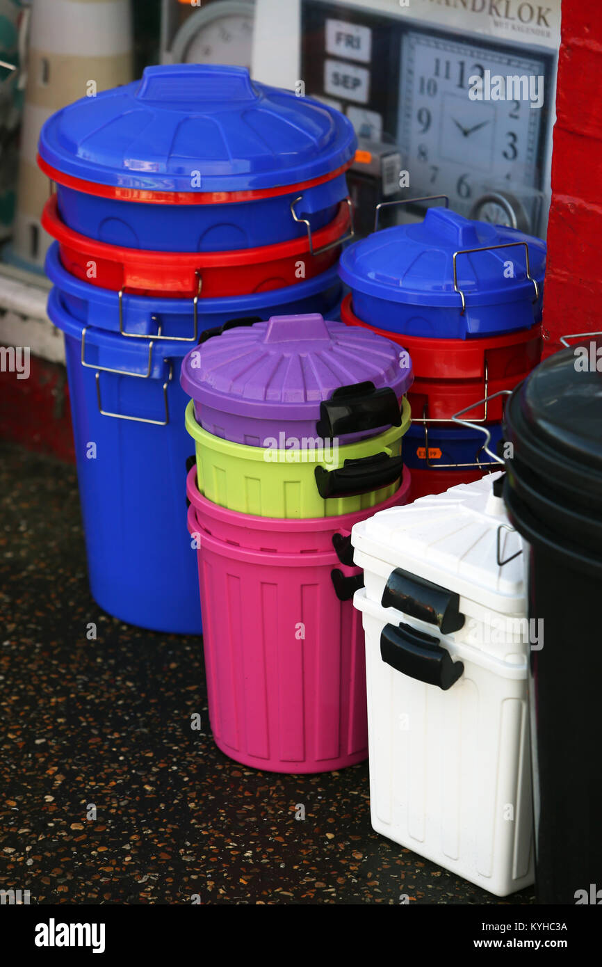 Coloured plastic bins pictured outside an independent discount store in