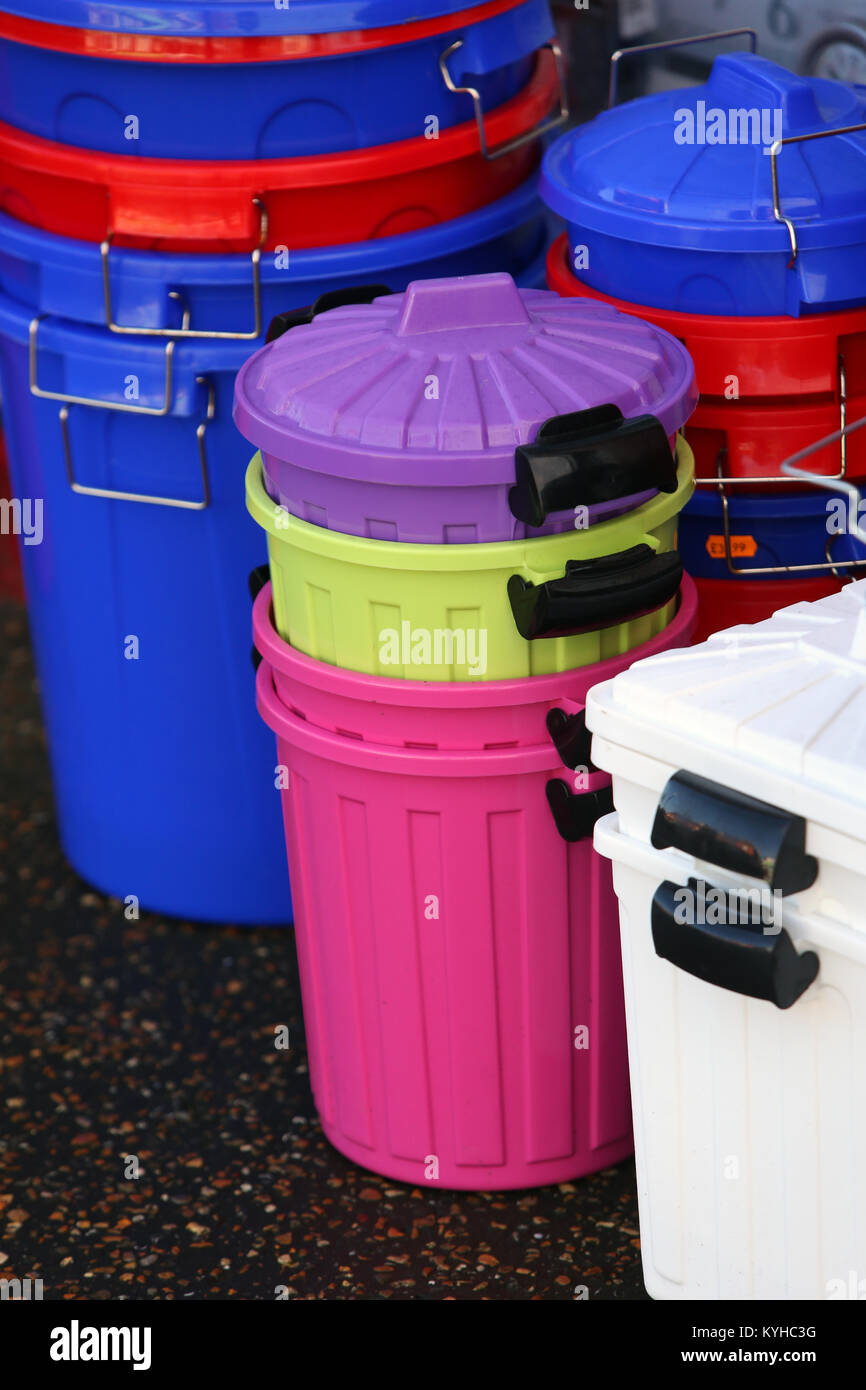 Coloured plastic bins pictured outside an independent discount store in