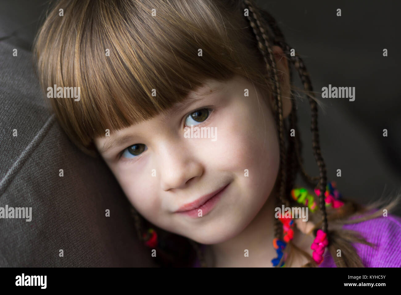 Portrait of pretty little girl with small braids Stock Photo - Alamy