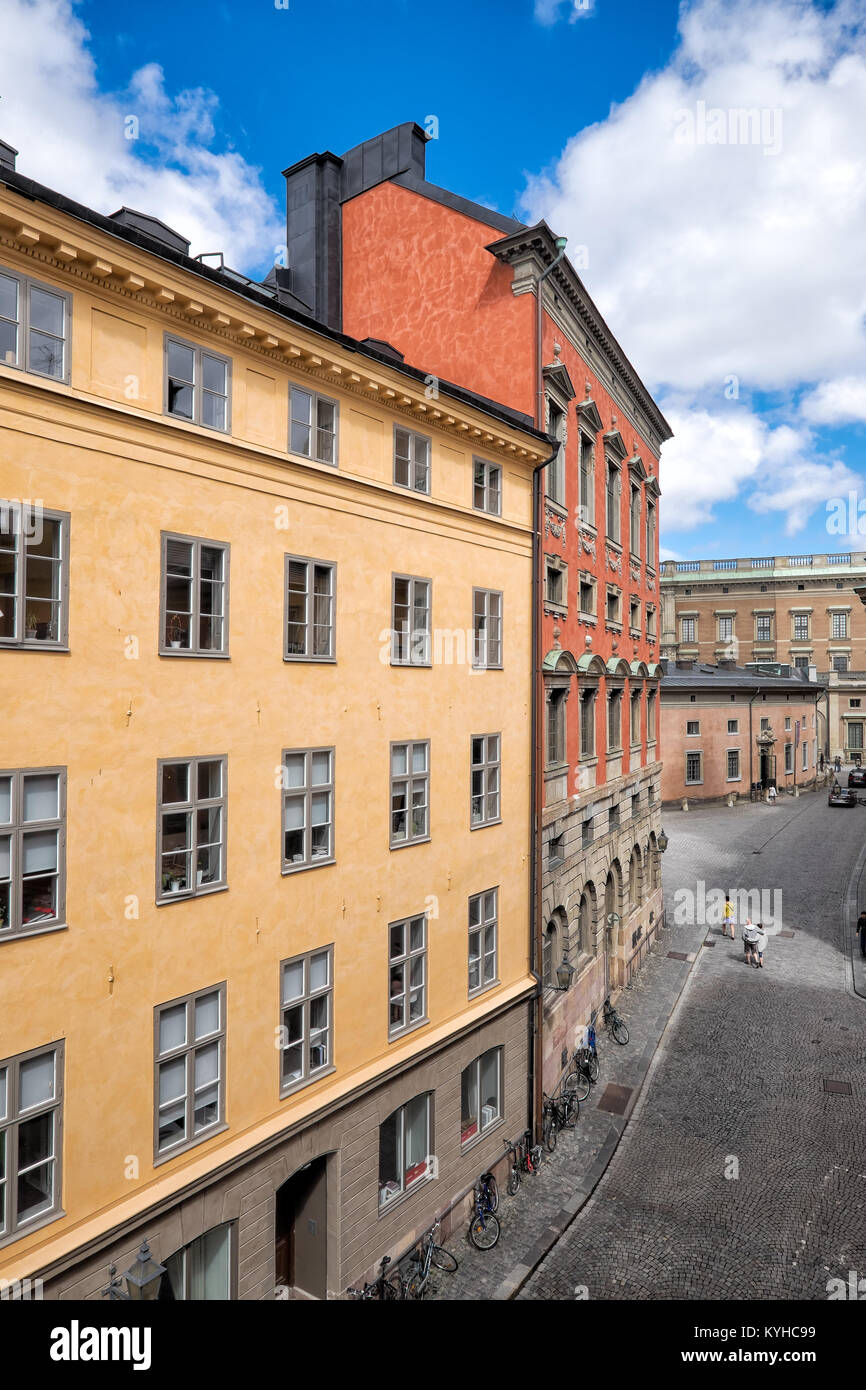 Stockholm Sweden colorful old town buildings against bright blue sky with white clouds. Location: Gamla Stan district Stock Photo