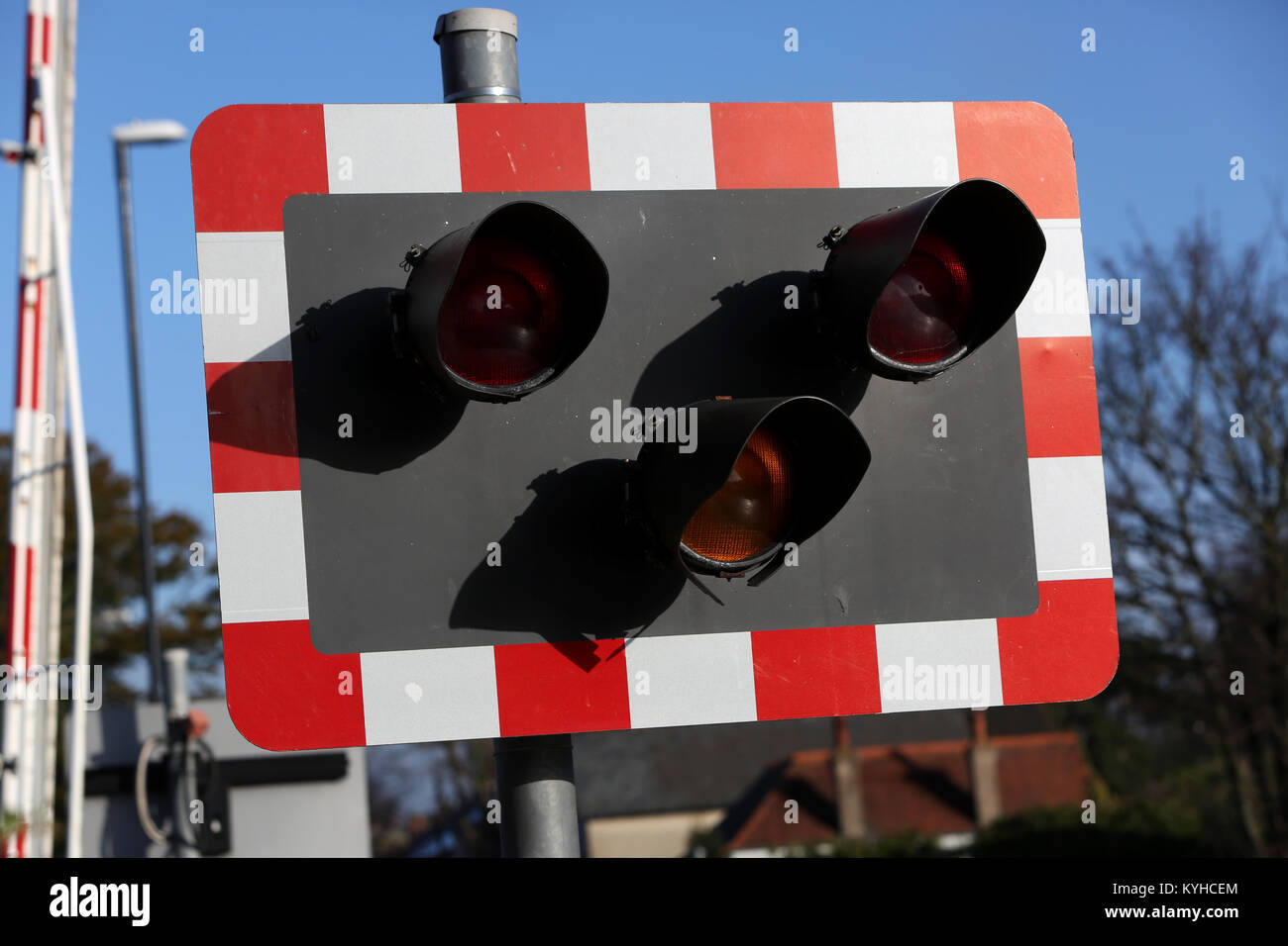 Closeup of railway crossing warning lights in Chichester, West Sussex