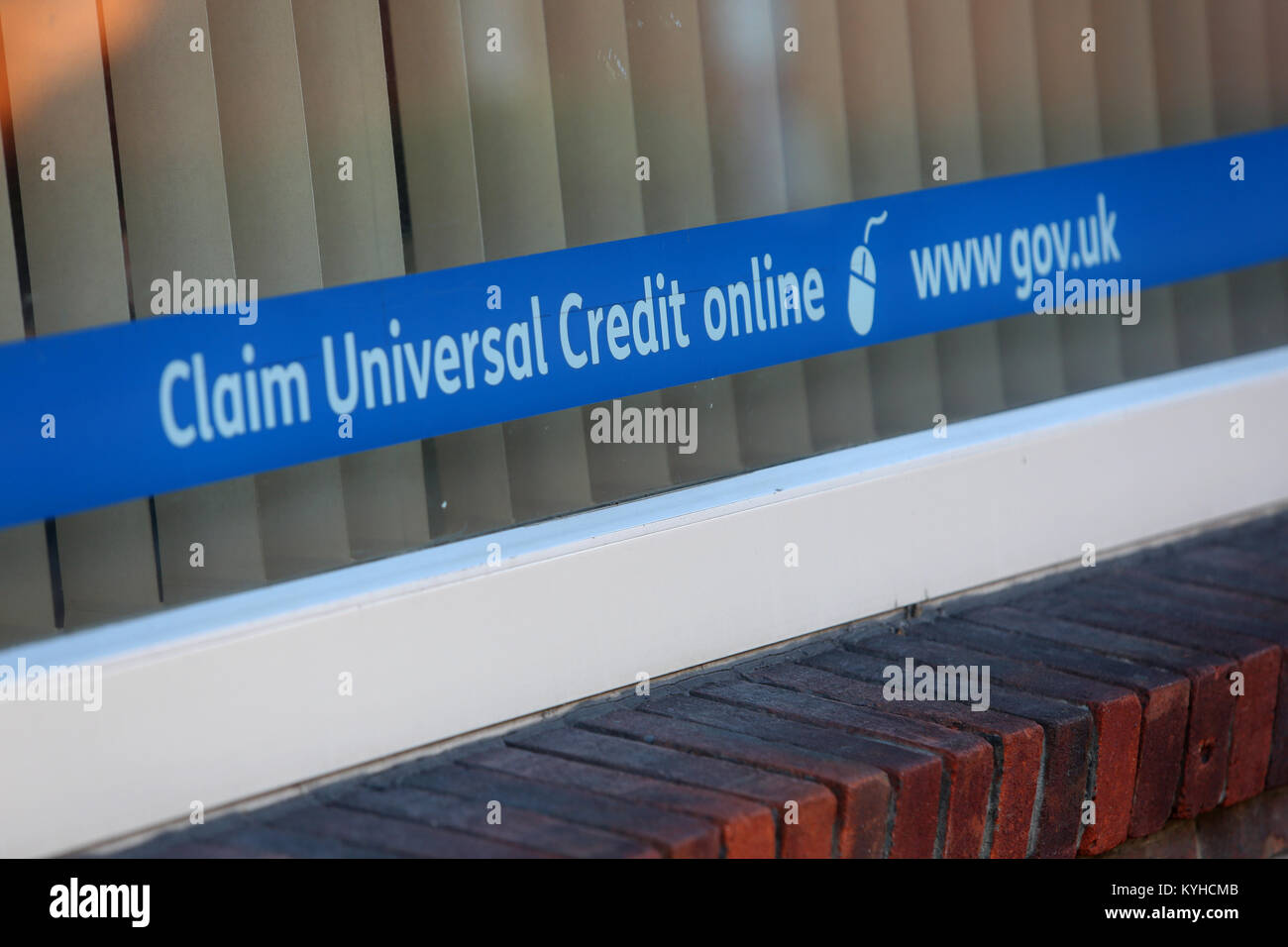 A Universal Credit sign pictured in the window of the job centre in